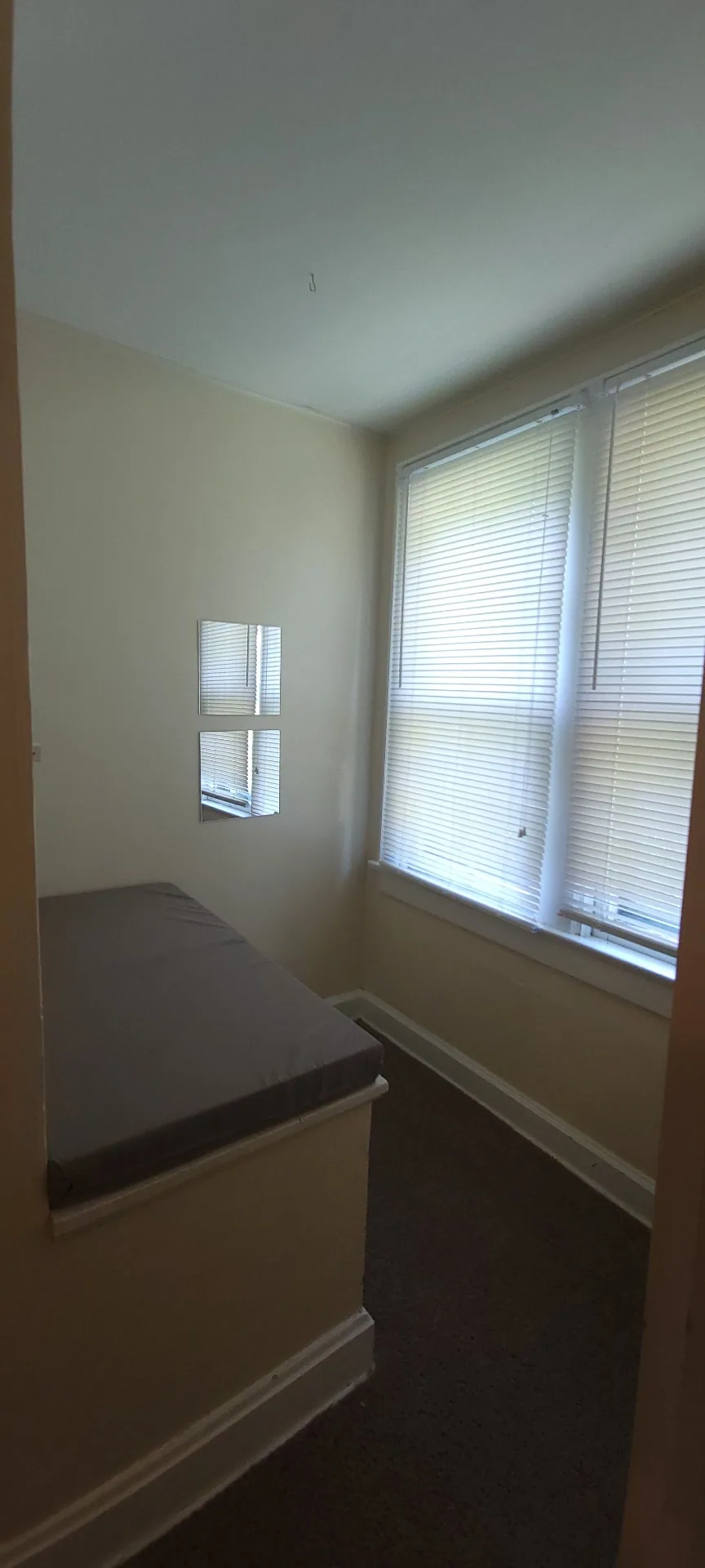 2054 Iuka Ave. C built-in window bench nook with large windows — cozy reading spot