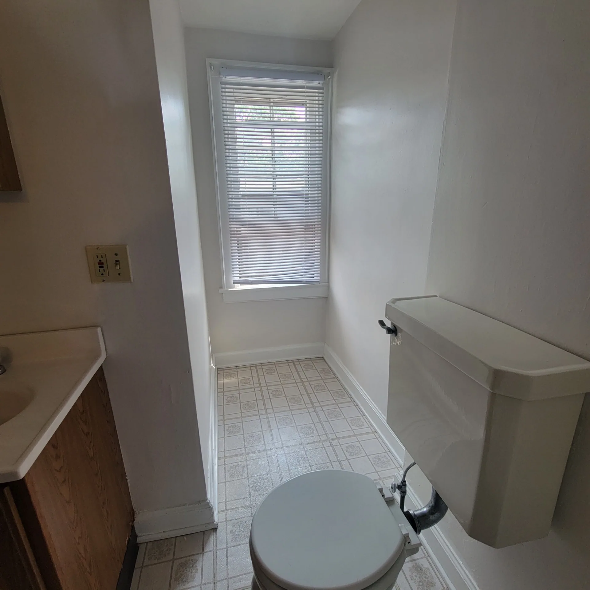 2048 Iuka Ave. C half bath showing toilet and bright window