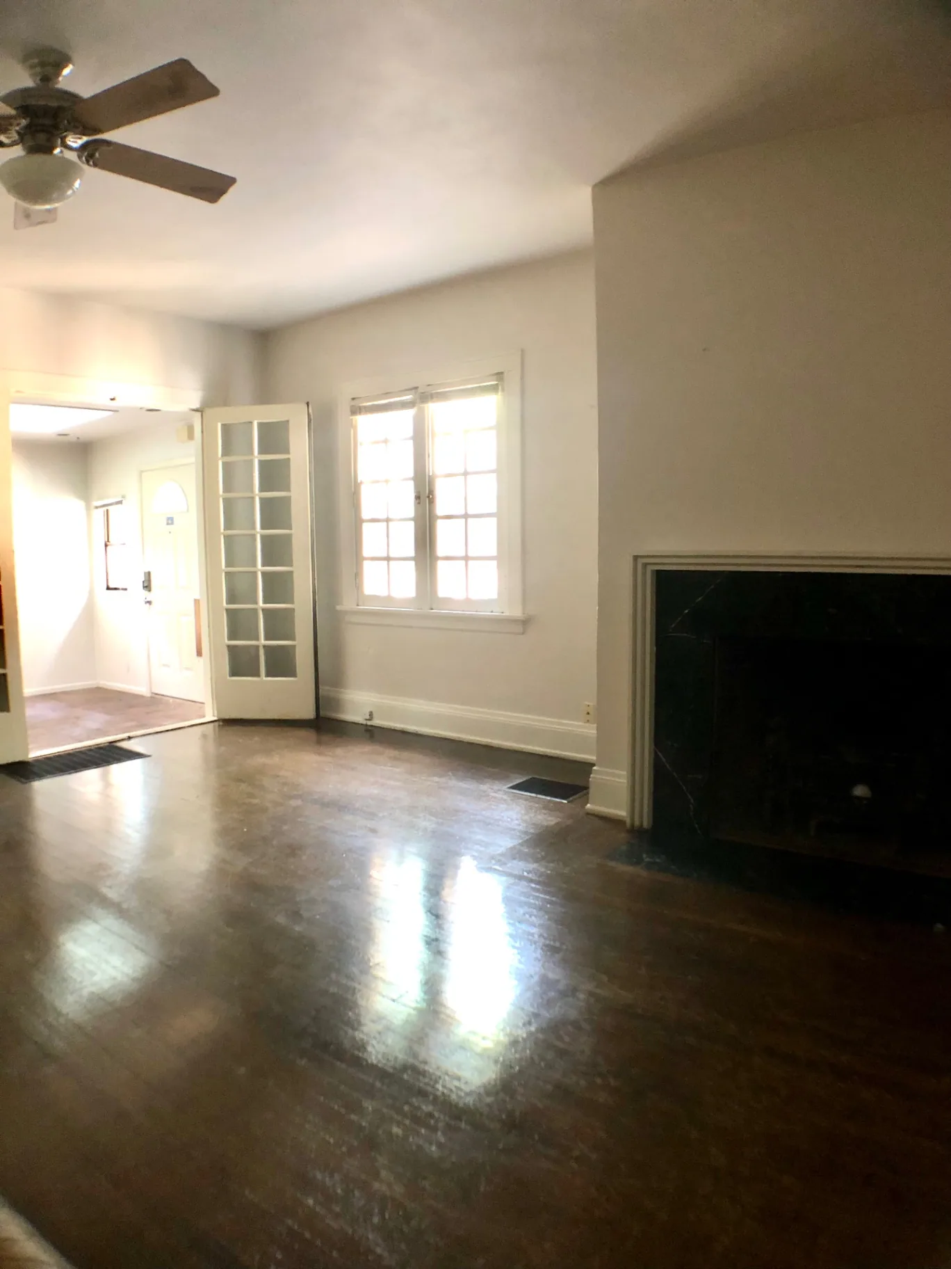 2026 Iuka Ave A living room with fireplace and French doors to the entry