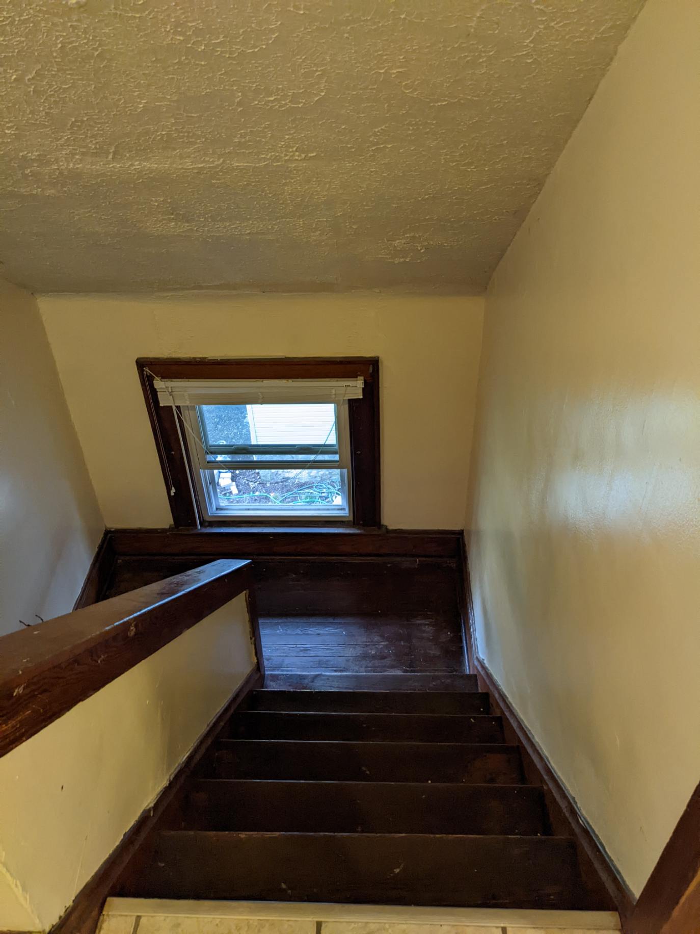 374 C E 14th Ave. private wood staircase with landing window