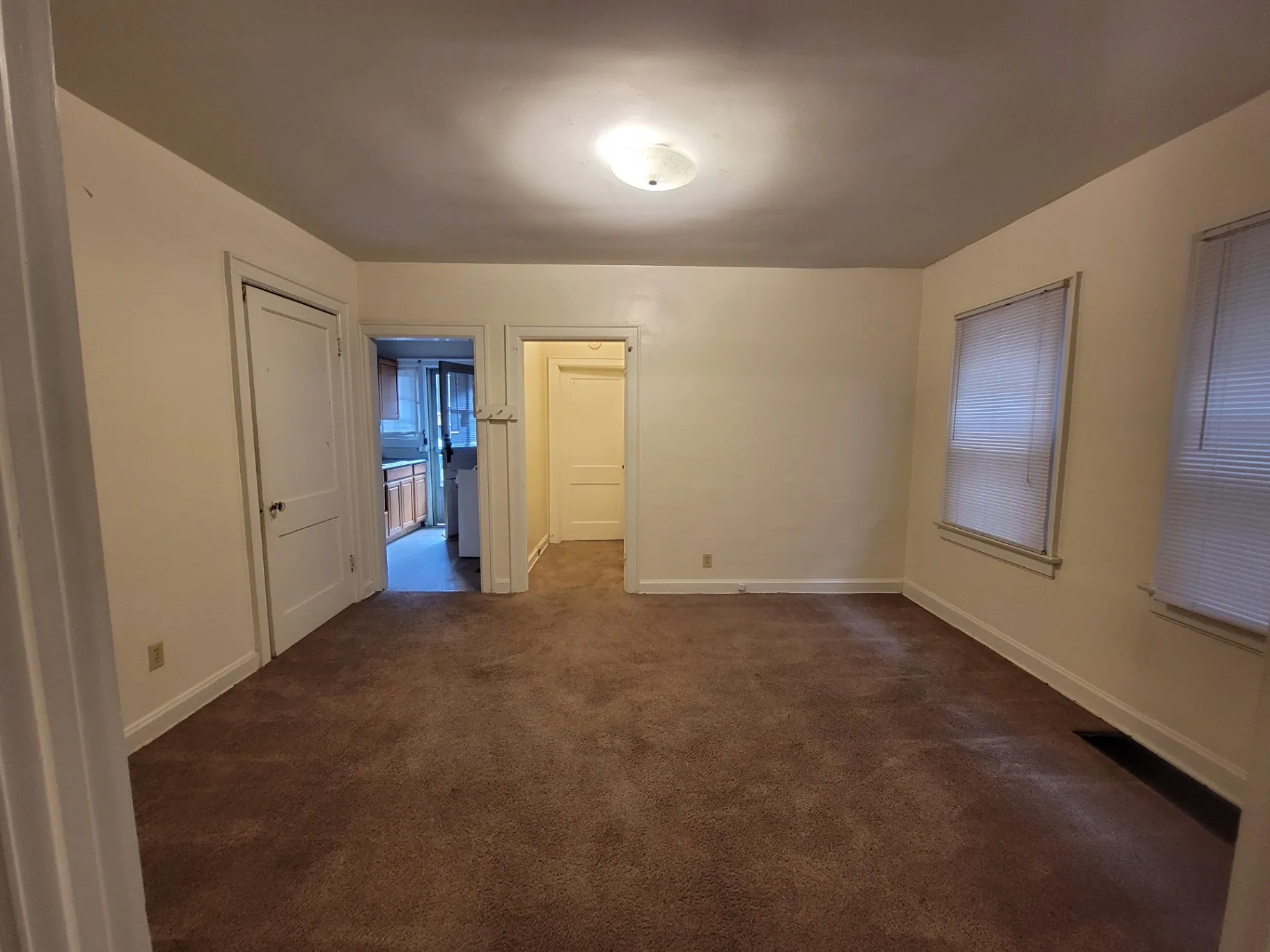 2048 Iuka Ave. B middle room usable as dining or office, with doorways to kitchen and hallway