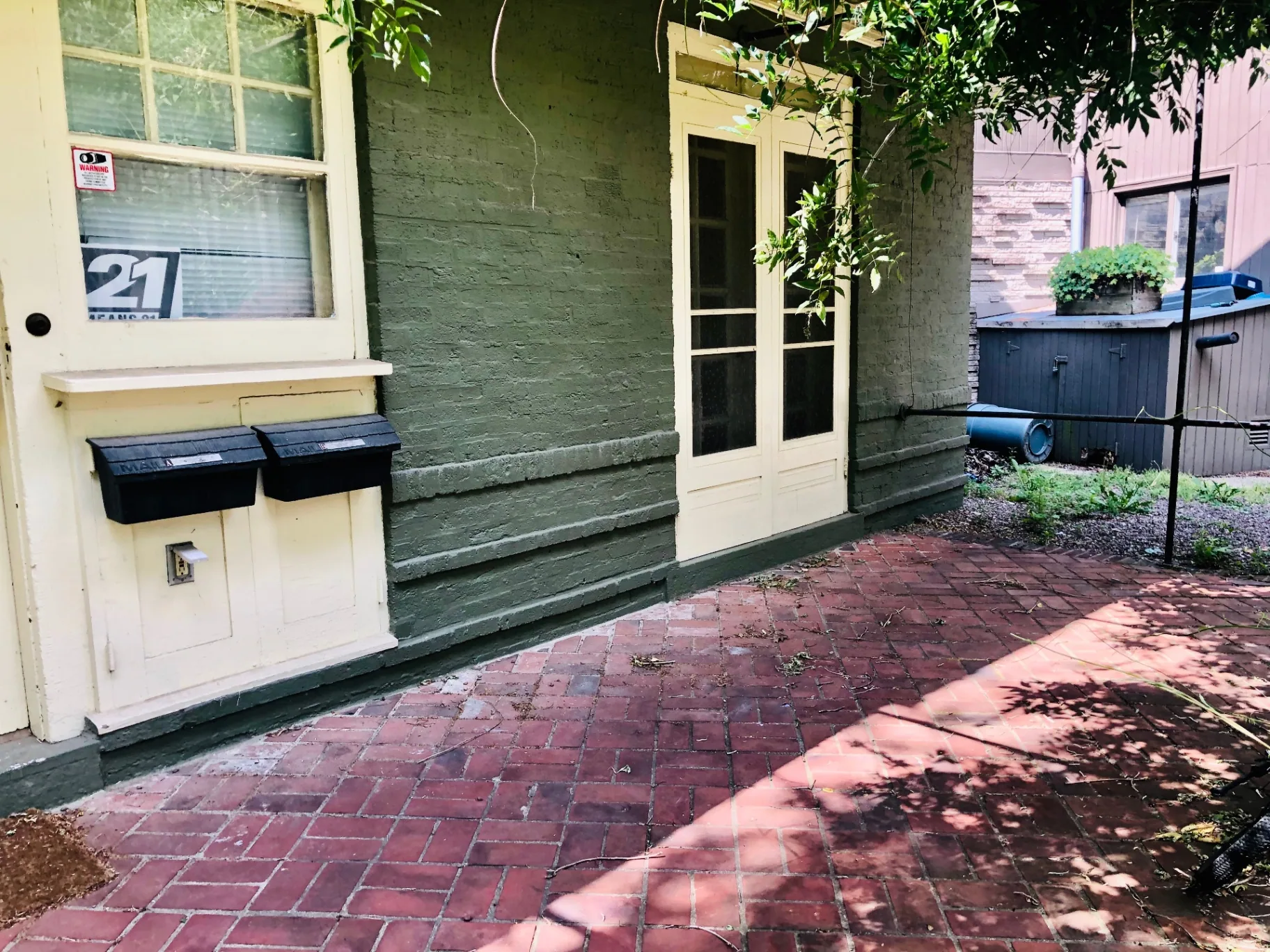 2034 Iuka Ave A private front entry with brick patio and French doors