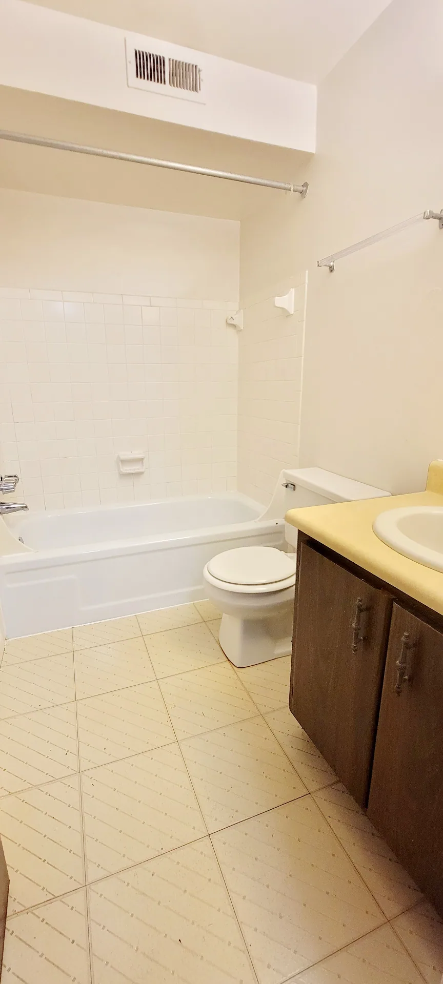 2022 Summit St. full bathroom with tub-shower, wood vanity, and tile floor