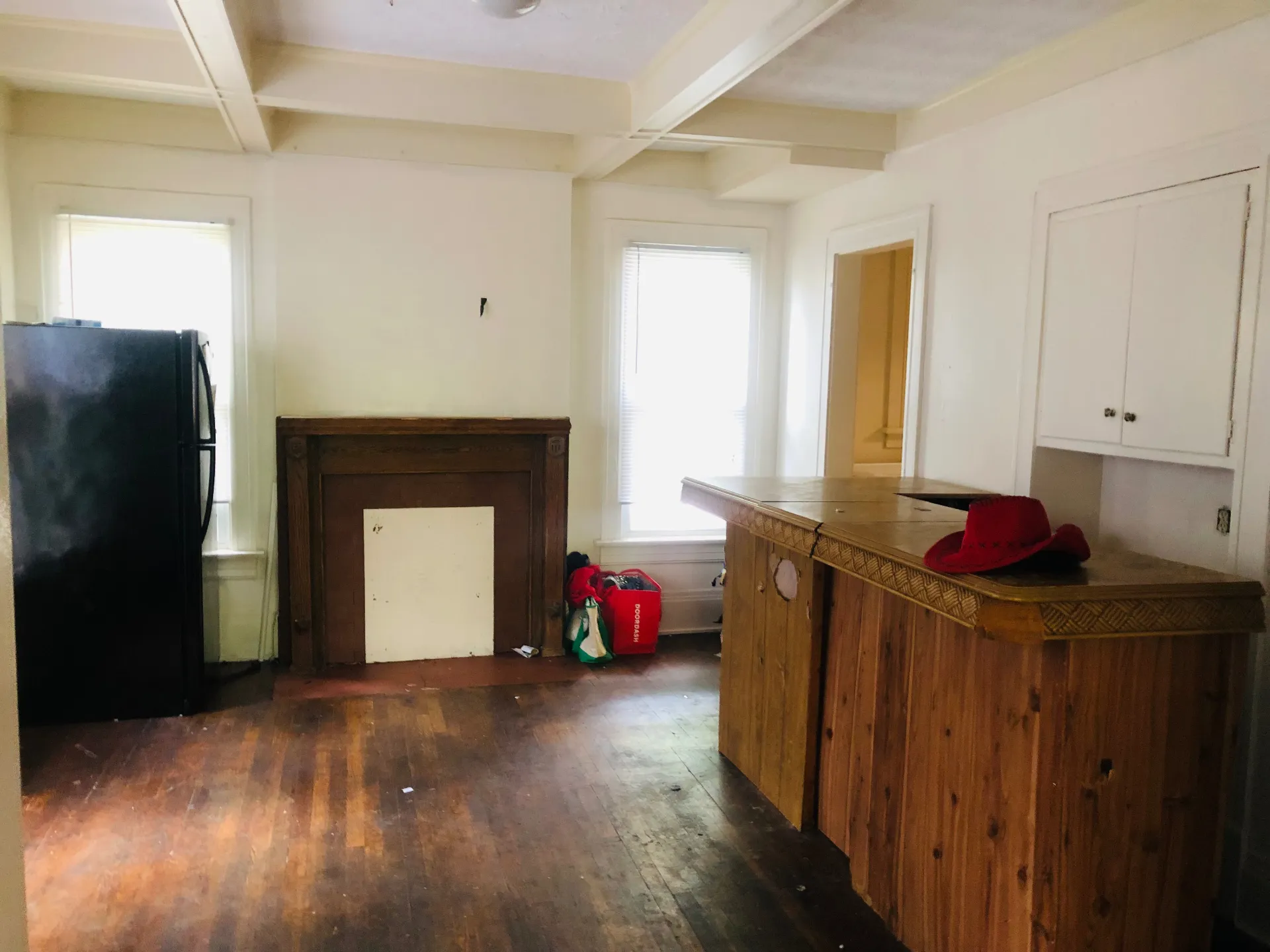 2005 Summit St. living room with decorative fireplace, wood bar, and hardwood floors