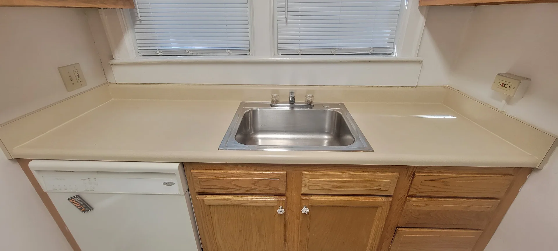 2054 Iuka Ave. A kitchen sink and countertop under double windows