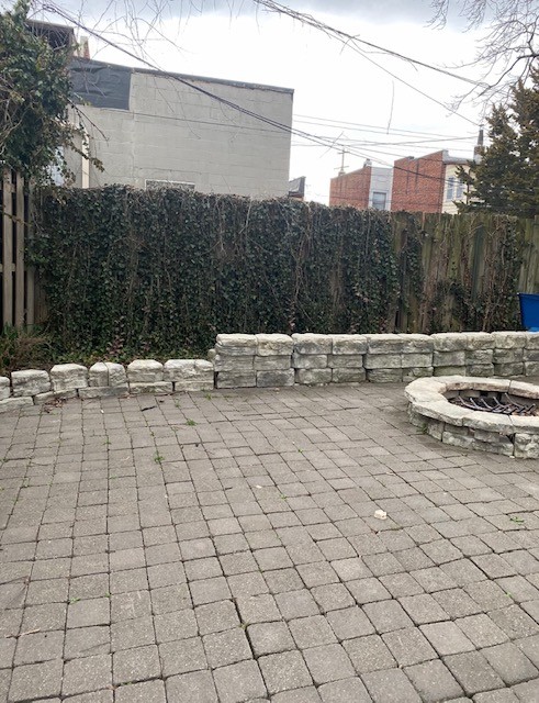 3338 Chestnut shared brick patio with stone fire pit and privacy fence