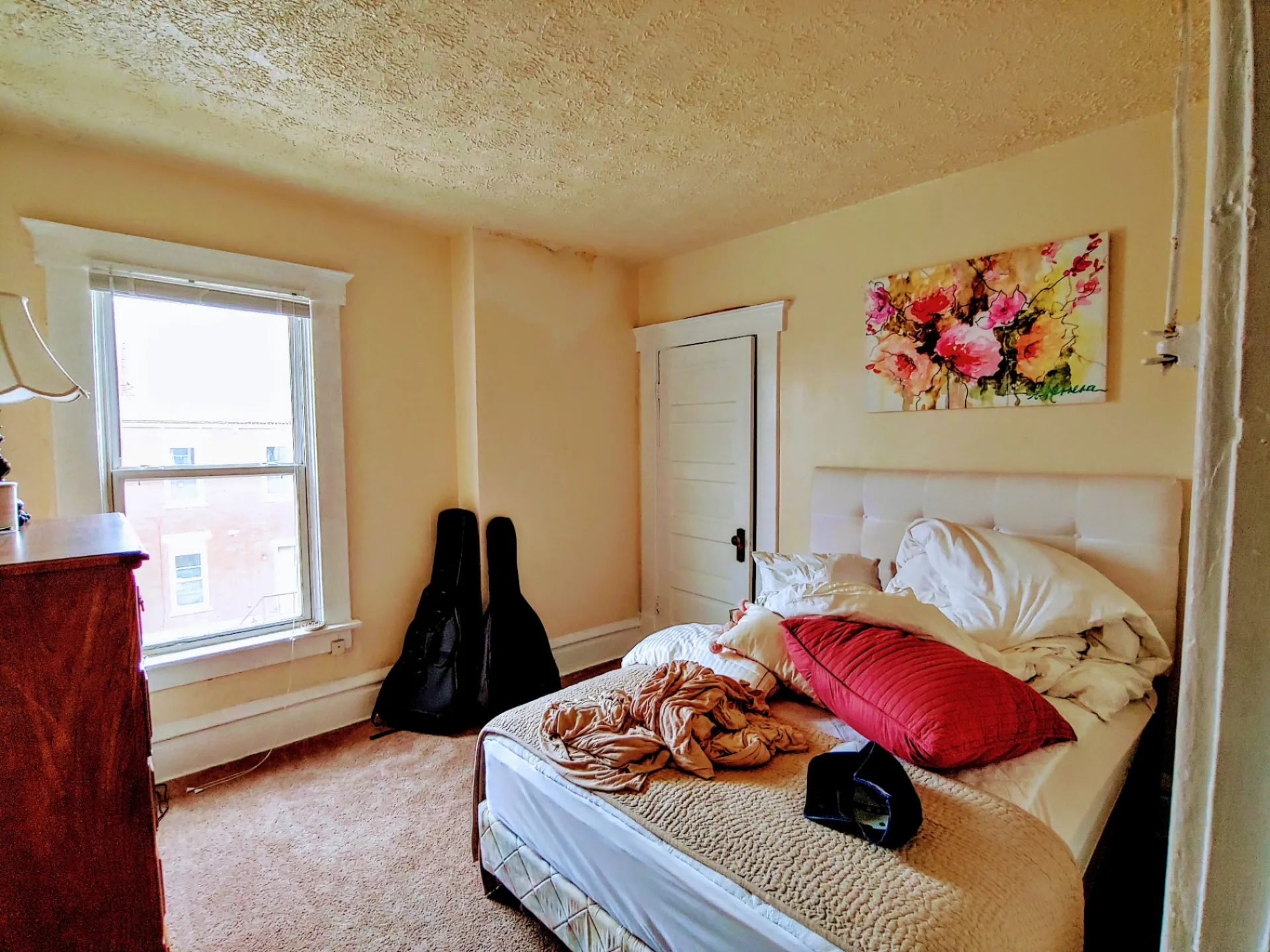 113 W 9th second bedroom with carpet and large window
