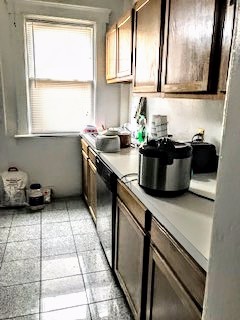 115 W 9th kitchen with oak cabinets and bright window