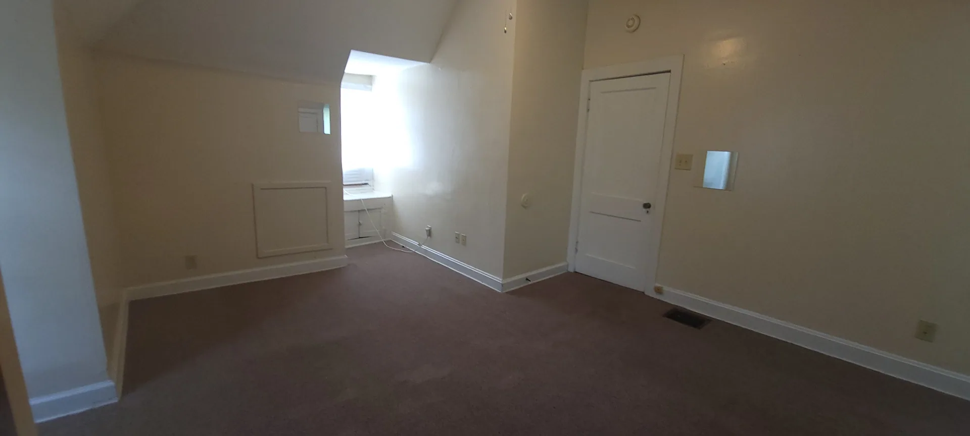 2054 Iuka Ave. C upstairs bedroom with vaulted ceiling and dormer alcove