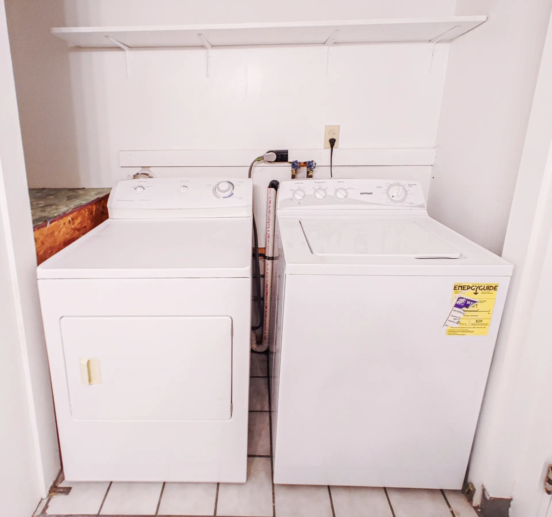Rear unit in-unit laundry closet with washer and dryer