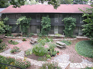 2040 Iuka Ave. 3A shared landscaped courtyard with brick walkways and mature vines