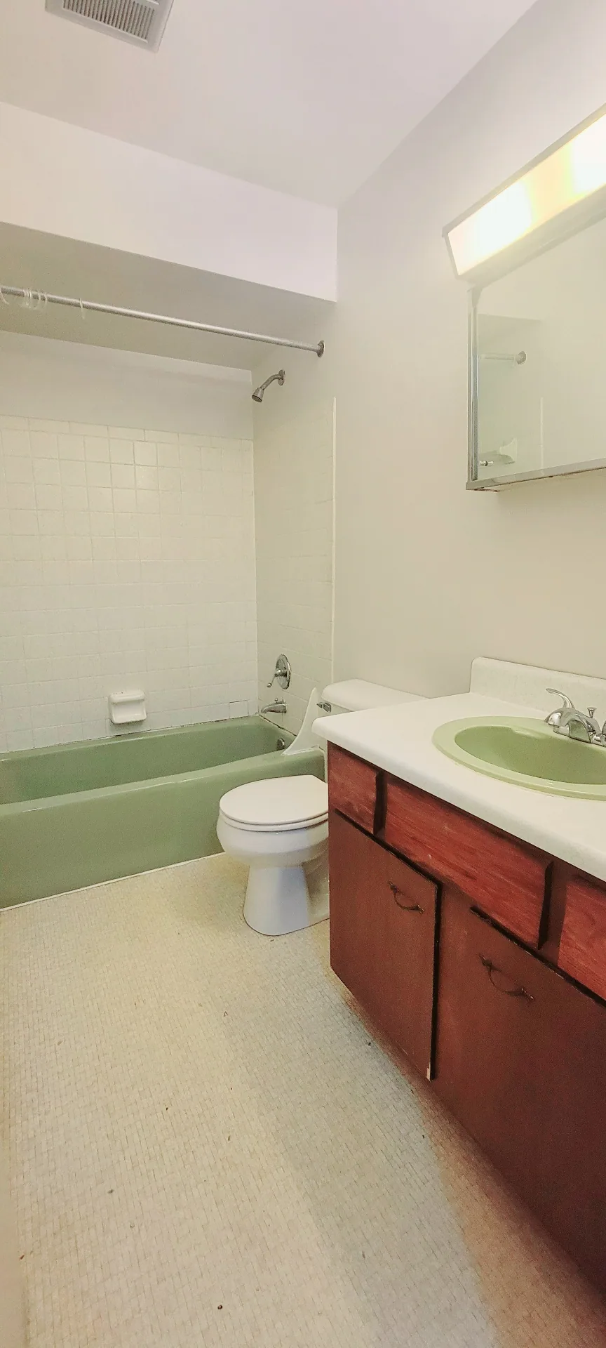 2022 Iuka Ave. full bathroom with tub-shower, wood vanity, and vanity lighting