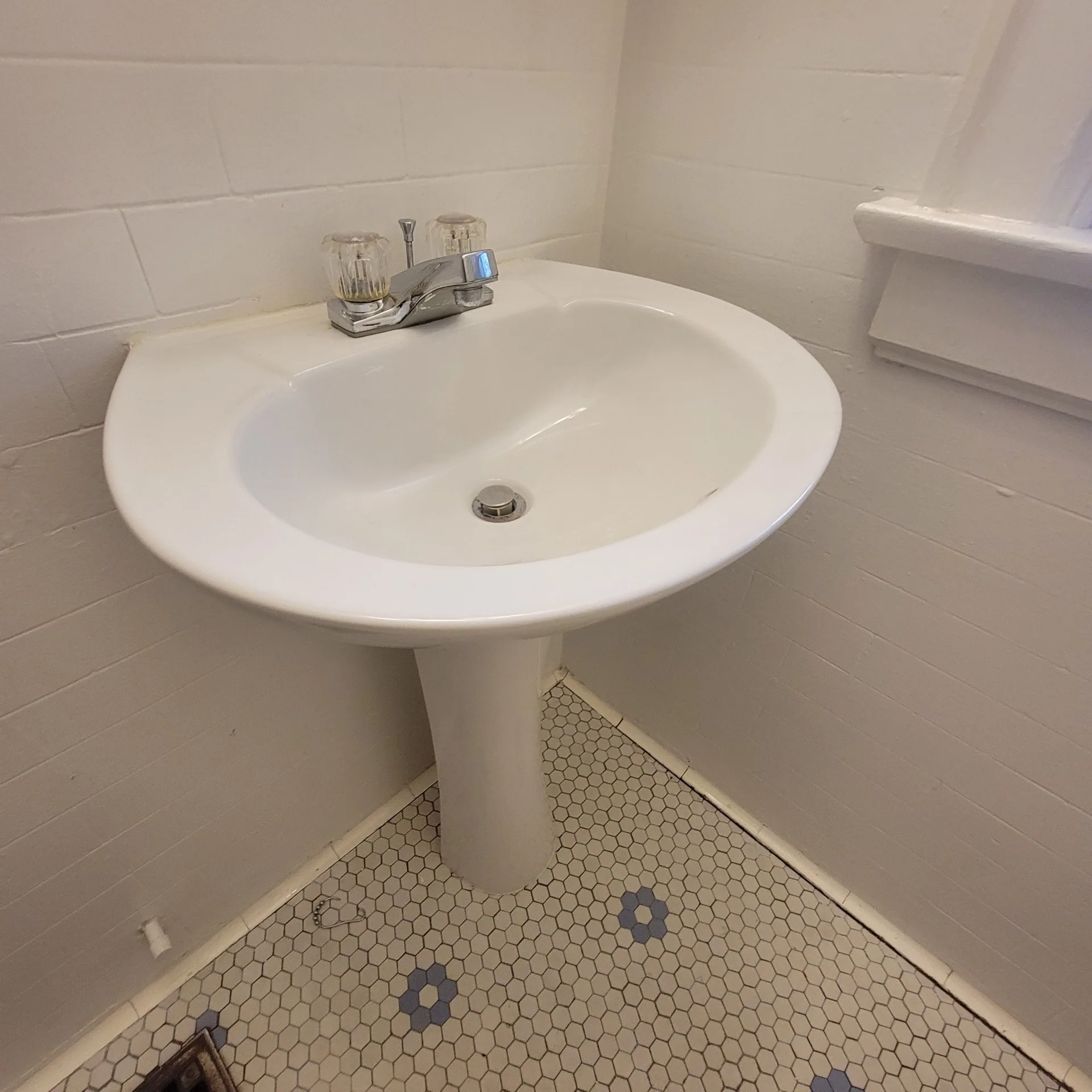 2048 Iuka Ave. C bathroom pedestal sink with vintage hex tile flooring