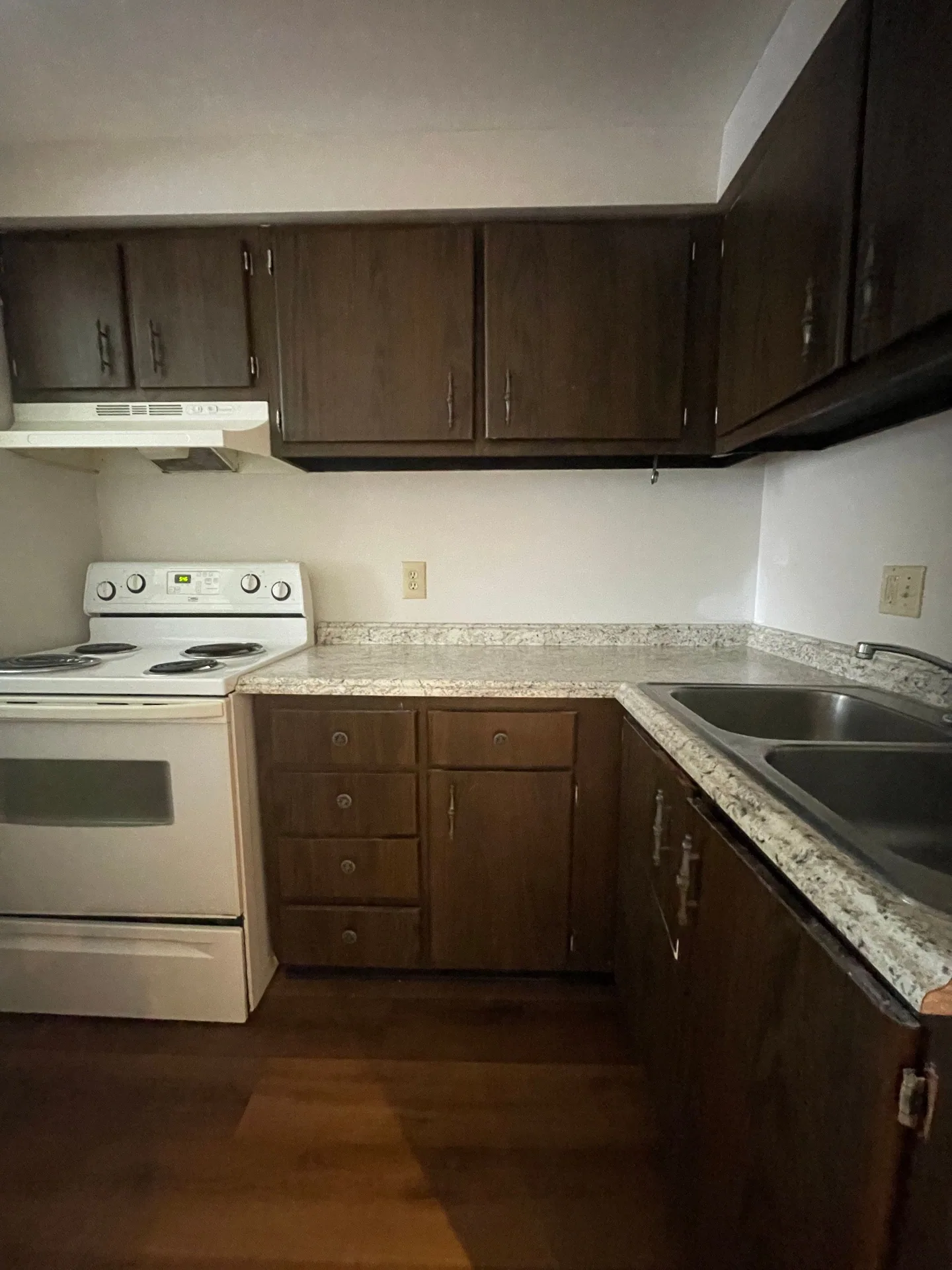 2020 Summit St. kitchen corner with dark wood cabinets, white range hood, and generous counter space