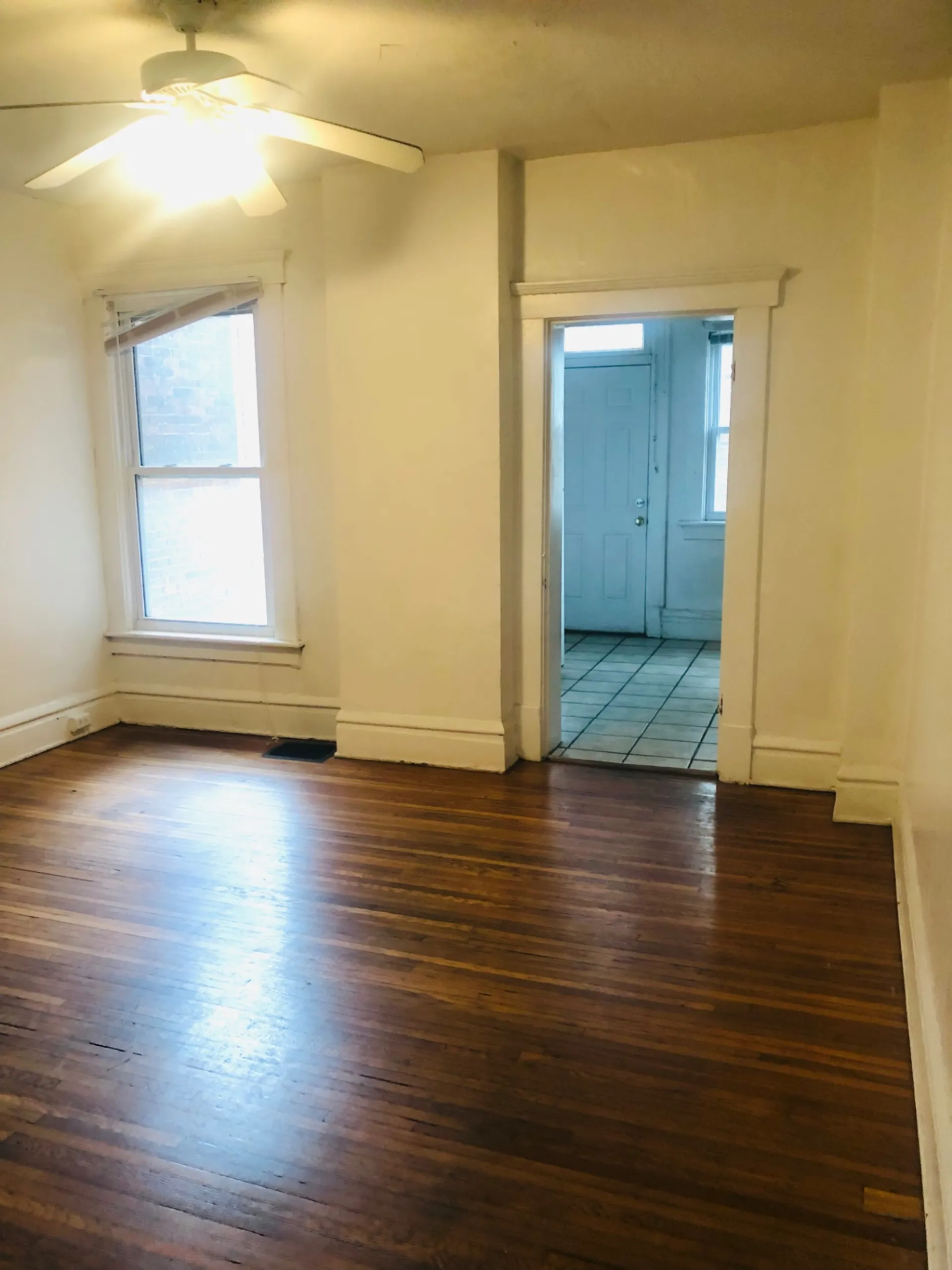 119 W 9th flex room with hardwood floors looking toward kitchen