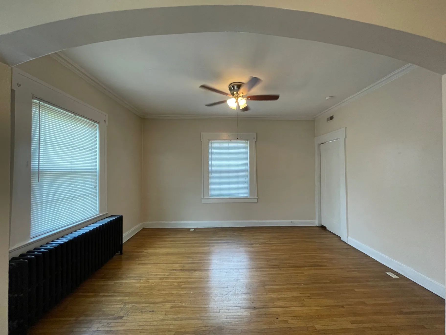 Unit E dining area with arched entryway
