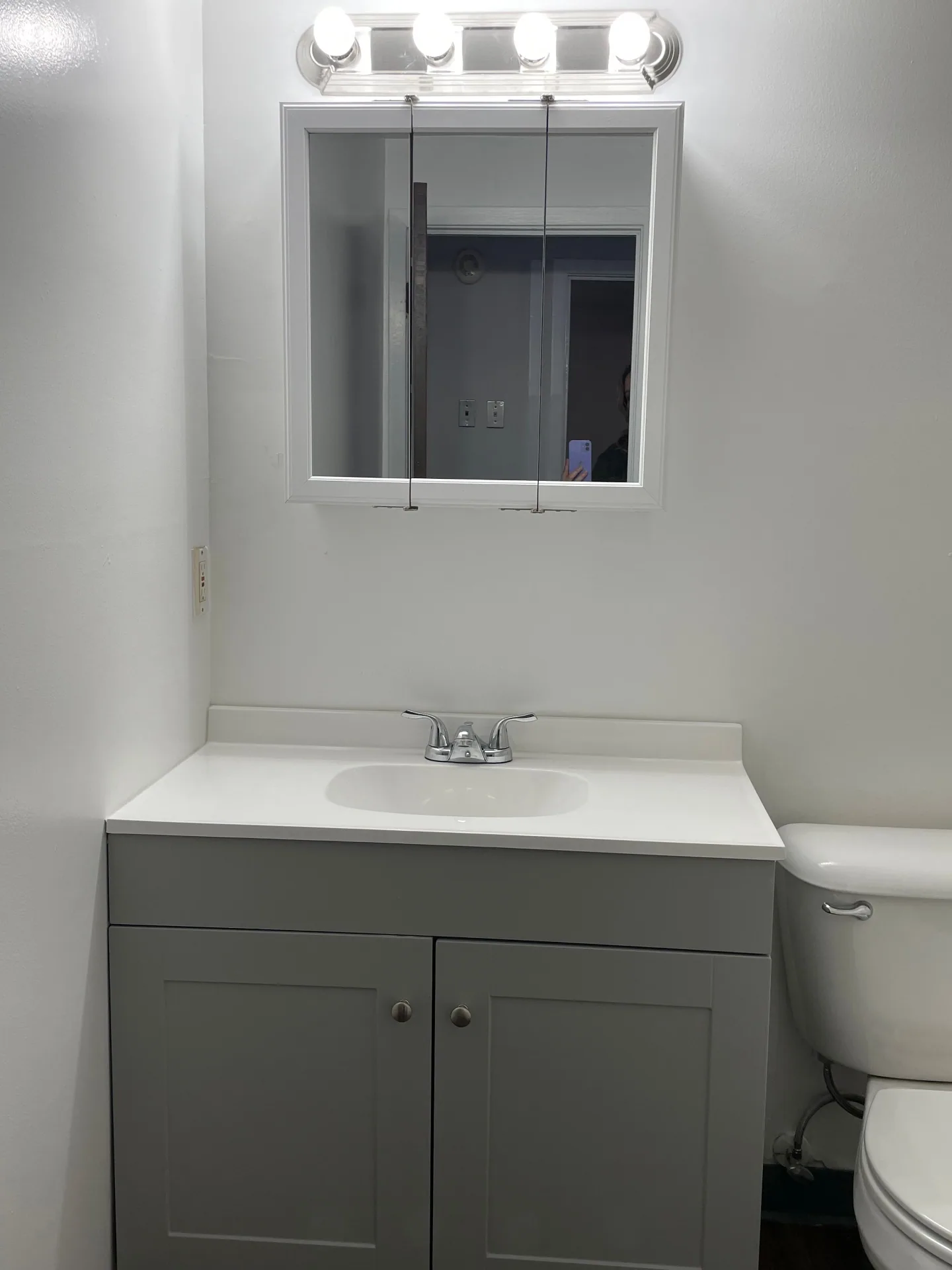 2020 Summit St. updated bathroom with grey shaker vanity, medicine cabinet, and new fixtures
