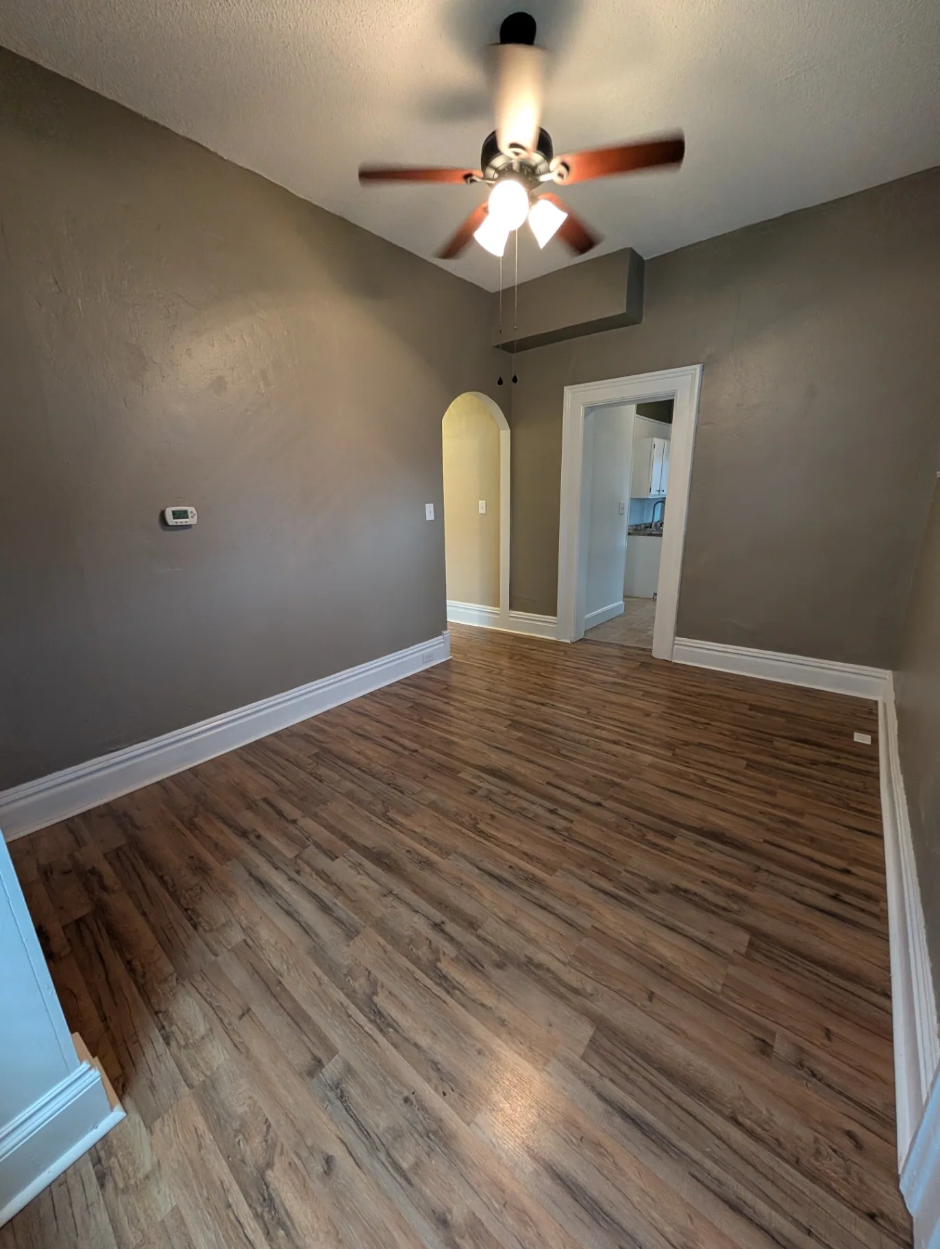 3338 Chestnut Downstairs dining room with archway leading to the kitchen