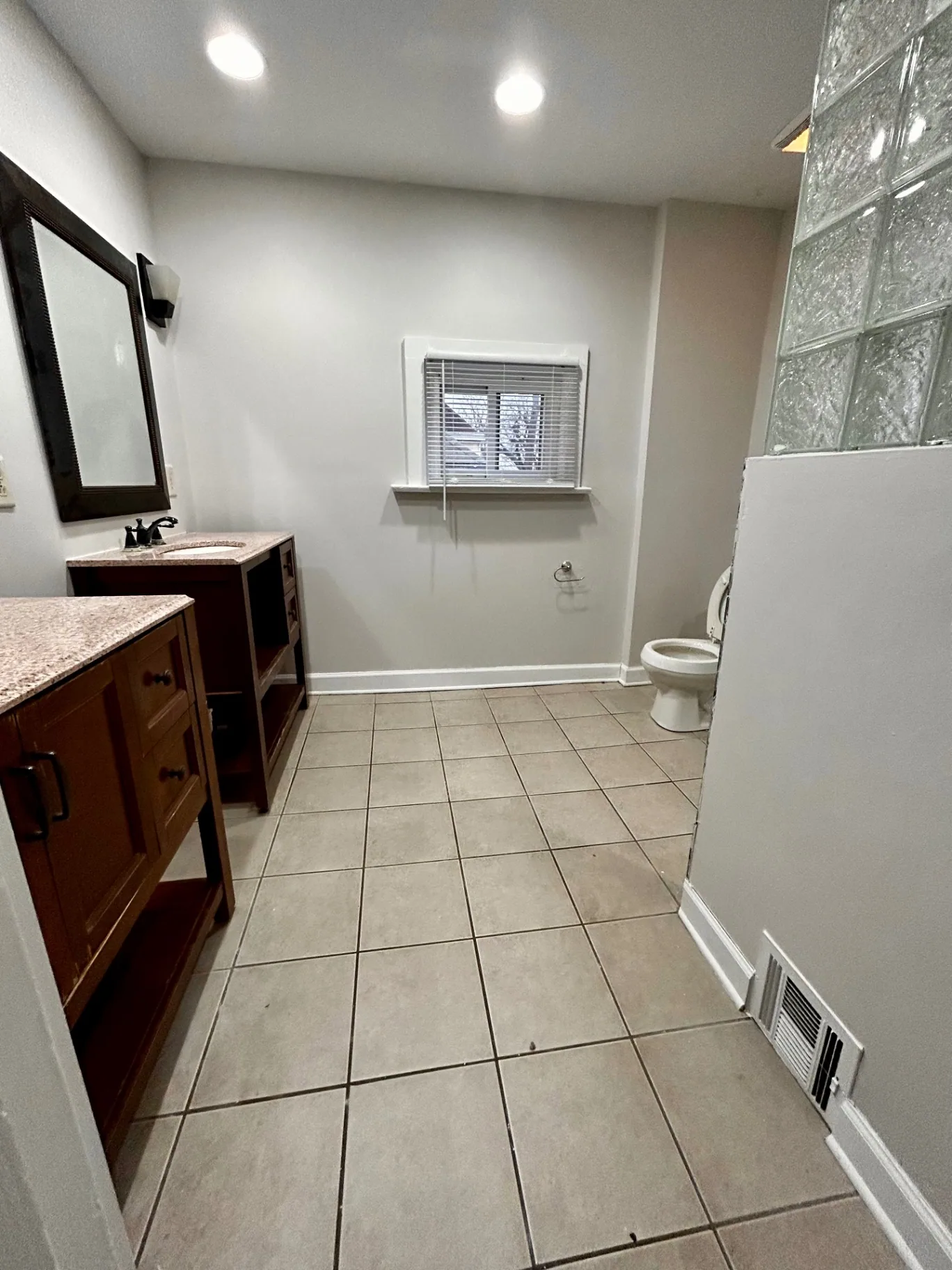 68 E Patterson Ave. spacious tile bathroom with vanity and glass-block accent wall