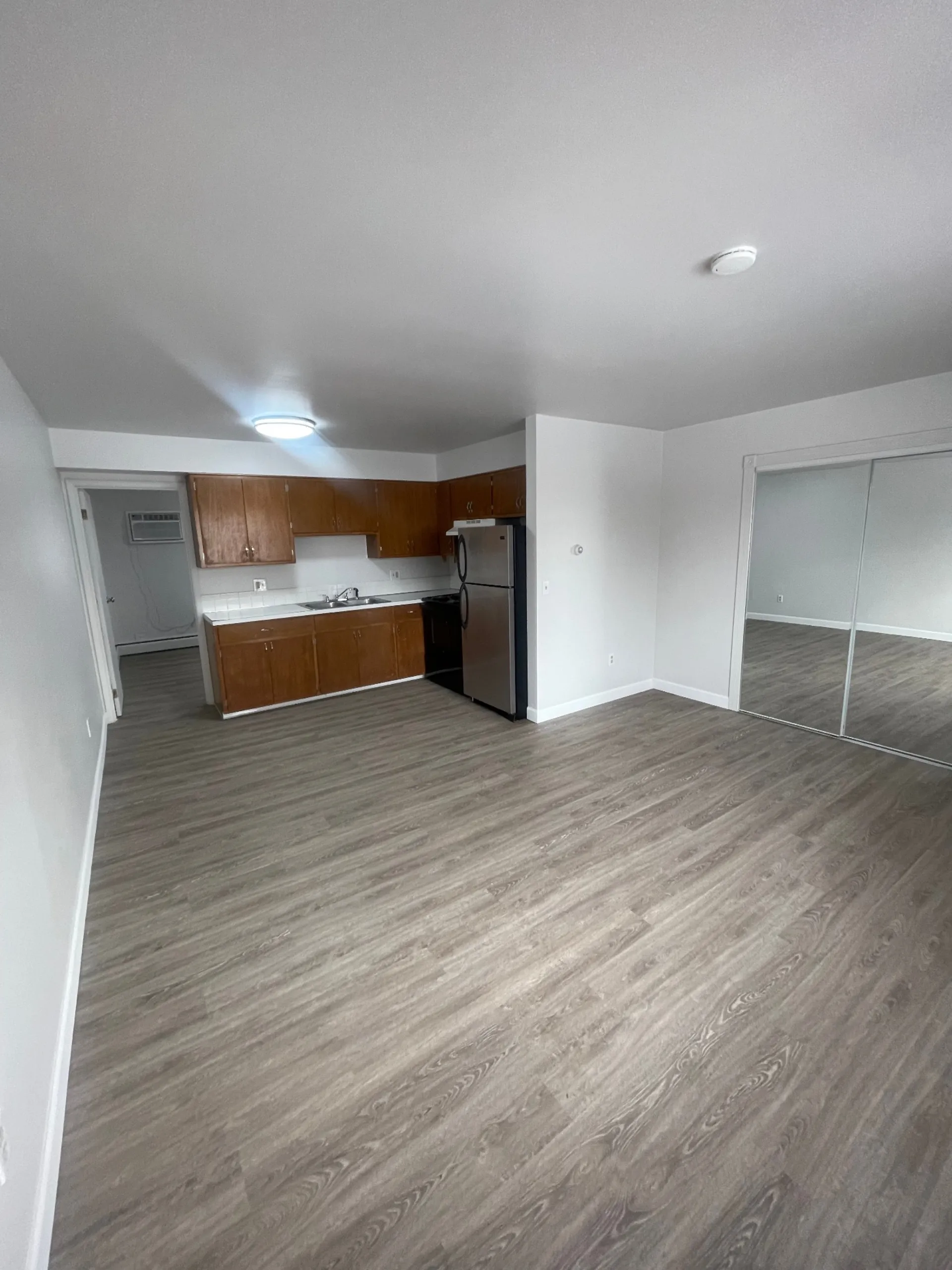 1827 N 4th St. Unit 8 spacious living area with adjacent kitchen and bedroom access