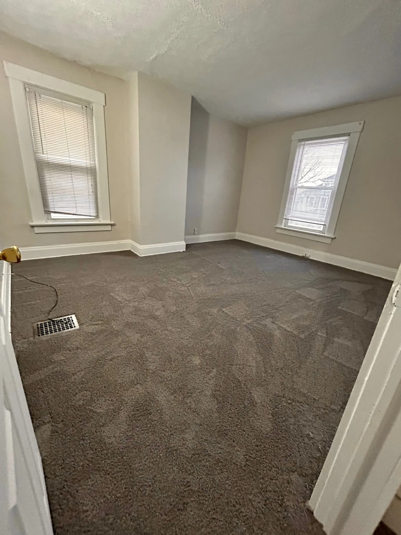 68 E Patterson Ave. corner bedroom with two windows and plush carpet