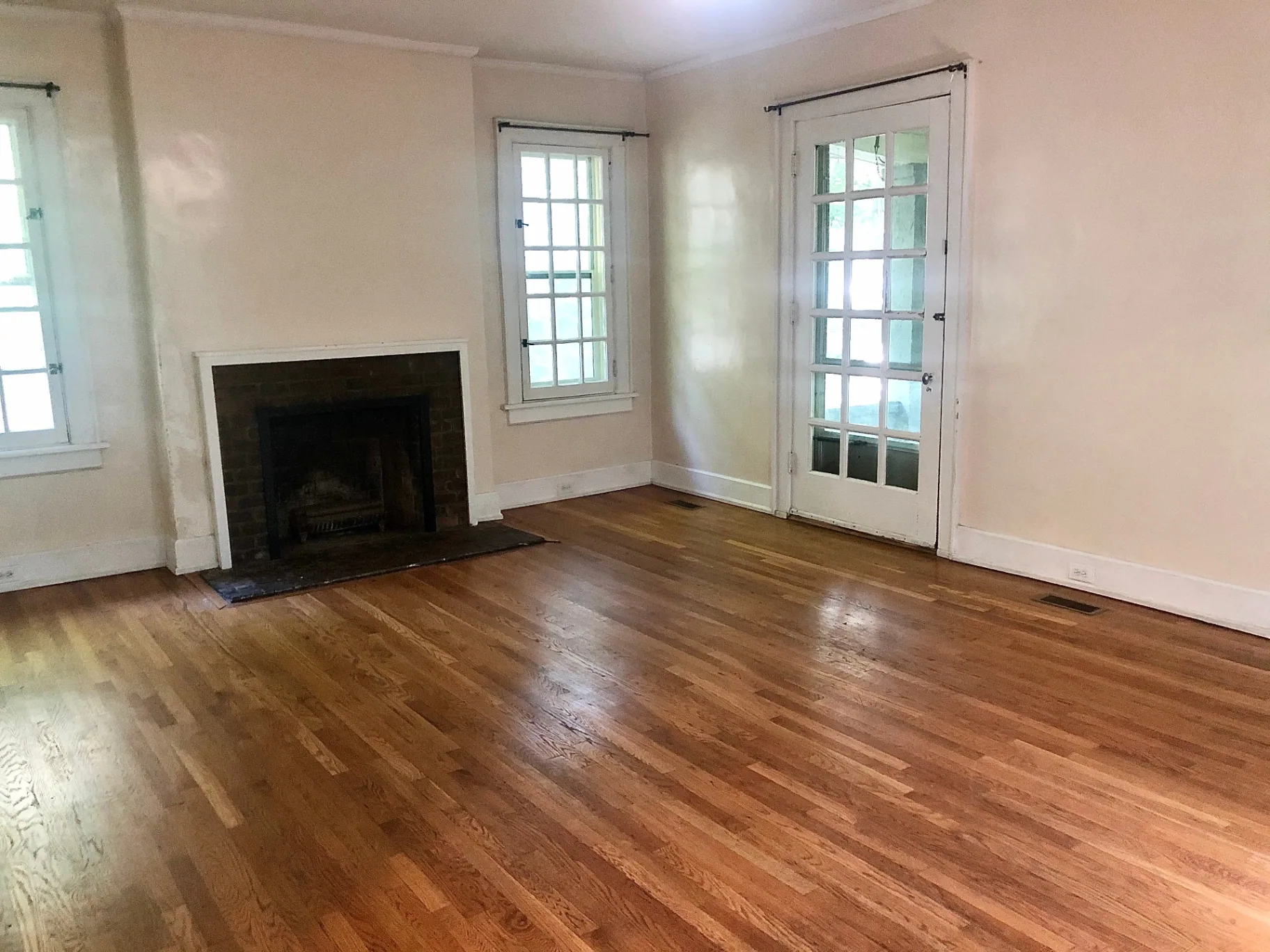 2034 Iuka Ave A living room with fireplace, hardwood floors, and French doors