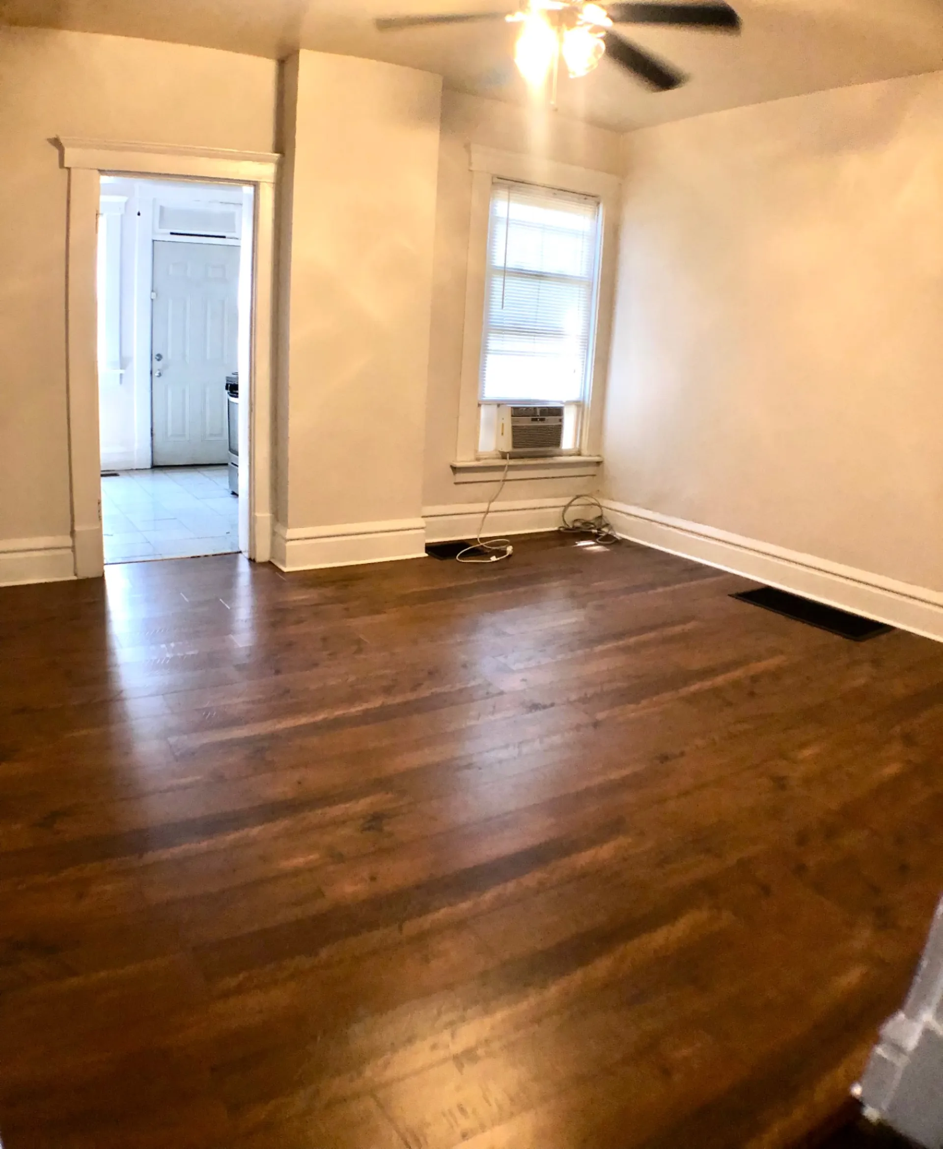 117 W 9th flex room with hardwood floors and ceiling fan