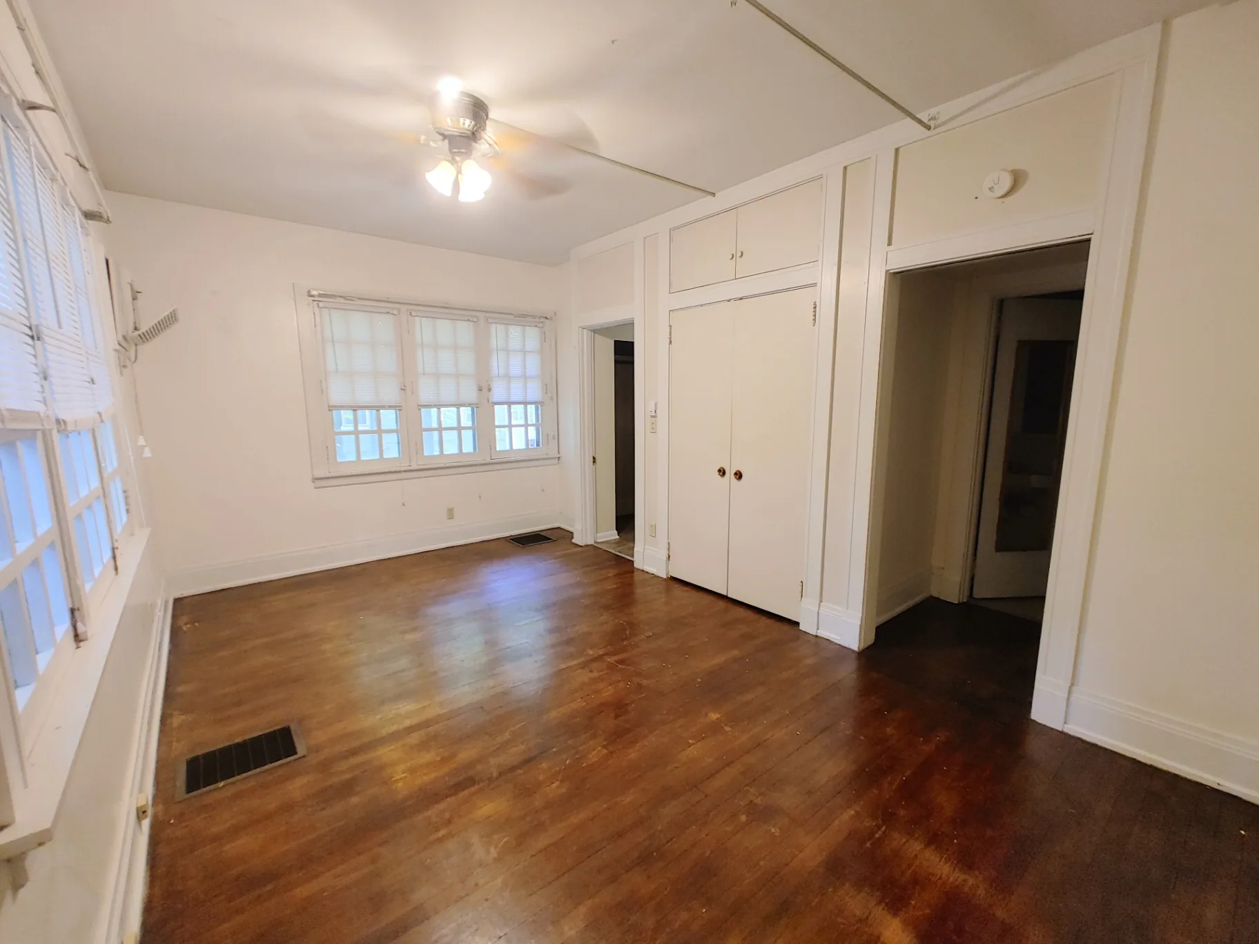 2026 Iuka Ave B sleeping/living area with hardwood floors and built-in closets