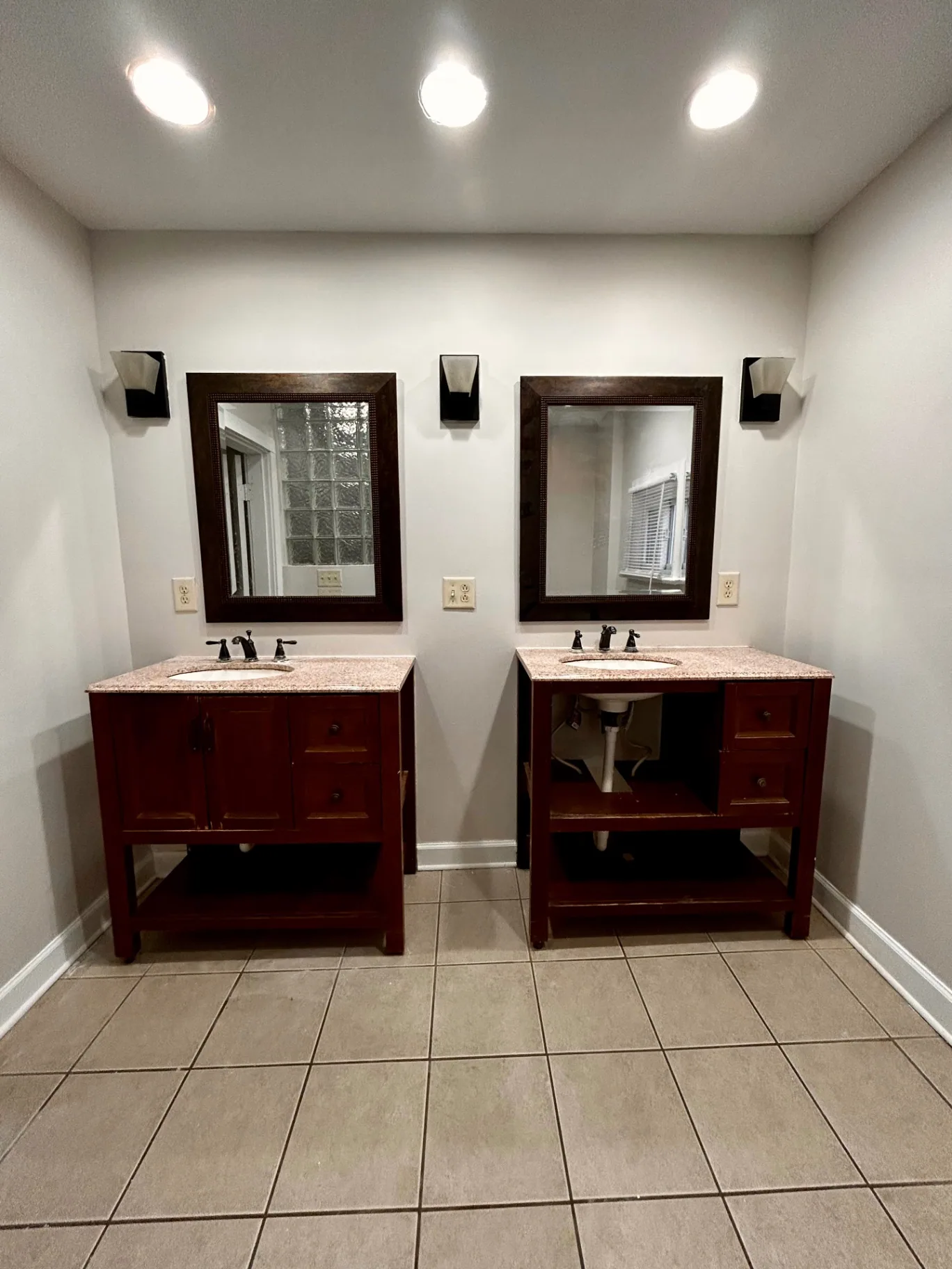 68 E Patterson Ave. bathroom with double vanities, granite tops, and framed mirrors