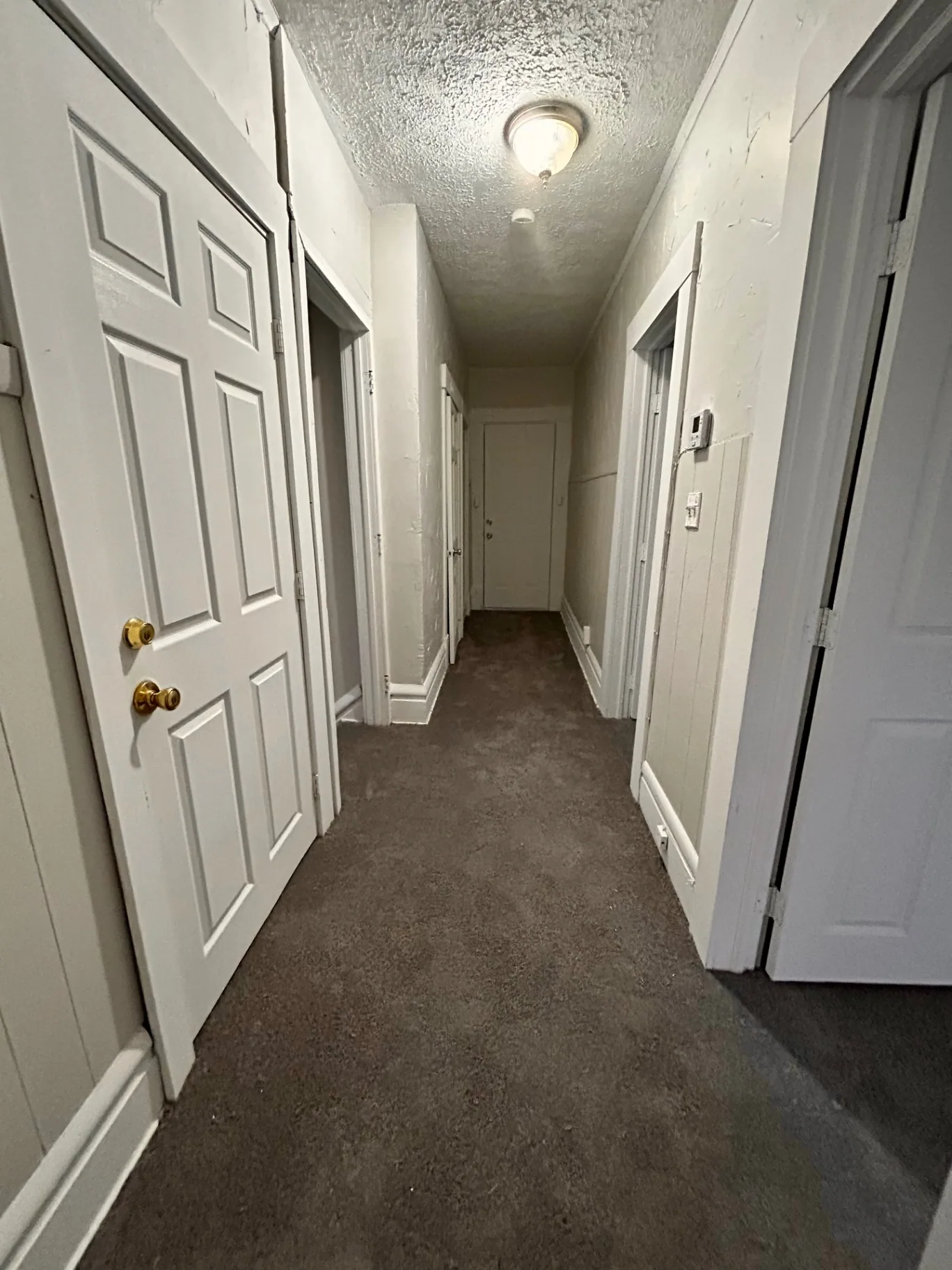 68 E Patterson Ave. upstairs hallway with multiple bedroom doors