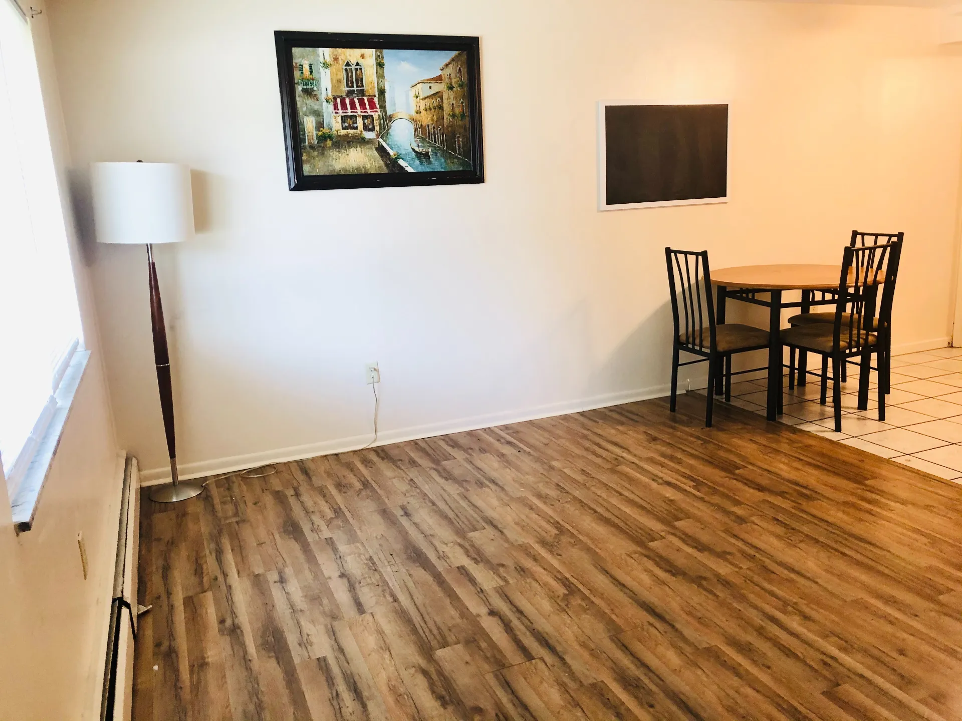 1827 N 4th St. Unit 2 dining area with wood-look flooring and floor lamp