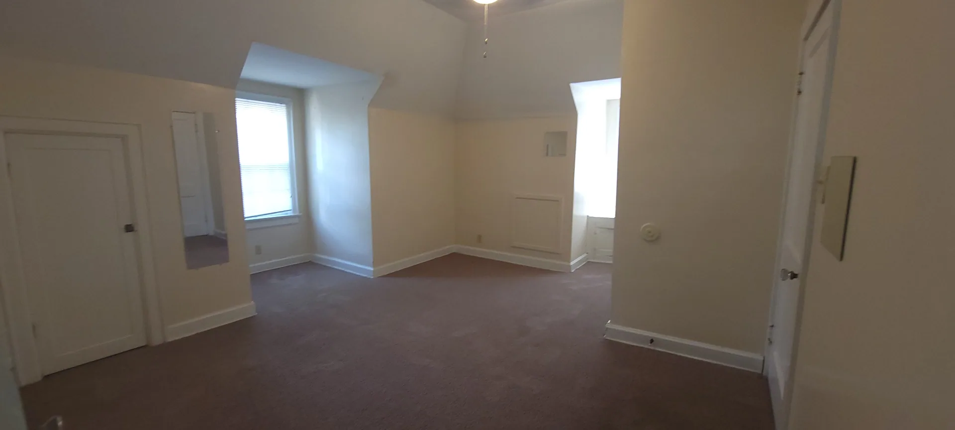 2054 Iuka Ave. C additional upstairs bedroom angle showing vaulted ceilings and generous open floor area