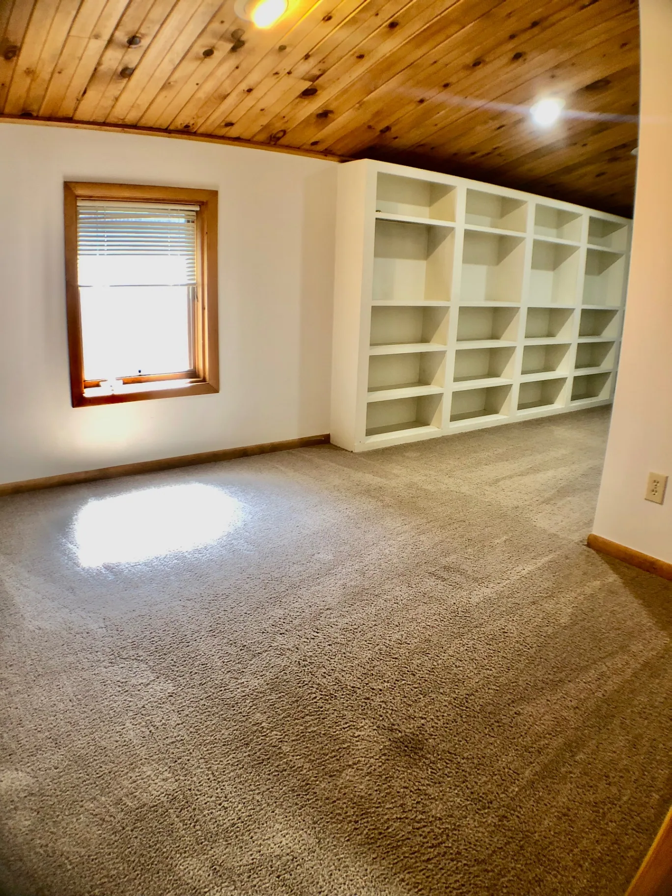 2040 Iuka Ave House upstairs room with wood ceiling and built-in bookshelves