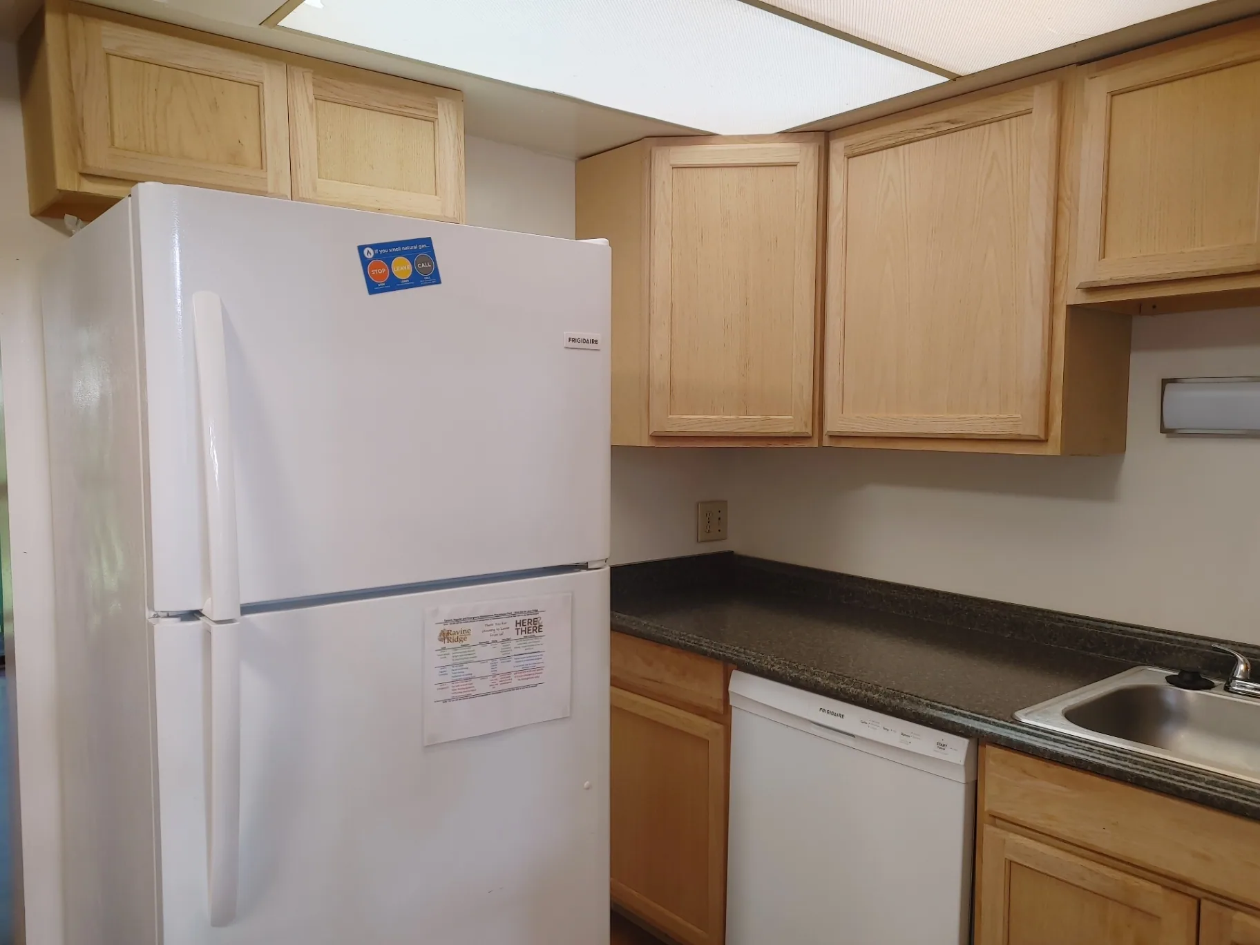 2016 Iuka Ave. kitchen with full-size refrigerator, dishwasher, and long prep counter