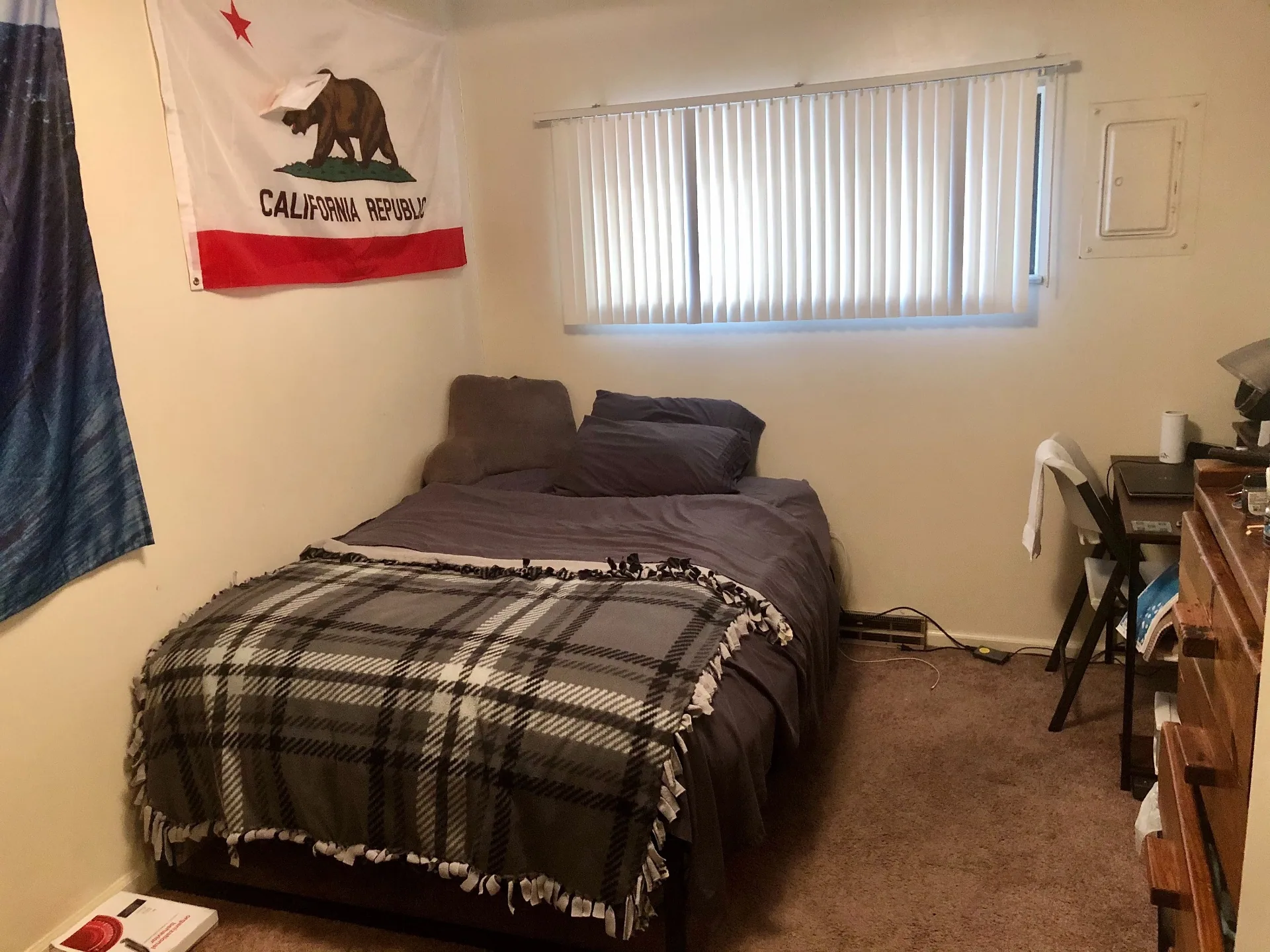 2024 Iuka Ave carpeted bedroom with large window