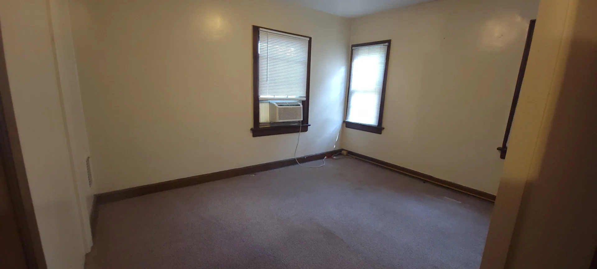 2054 Iuka Ave. C bedroom with two windows and window AC