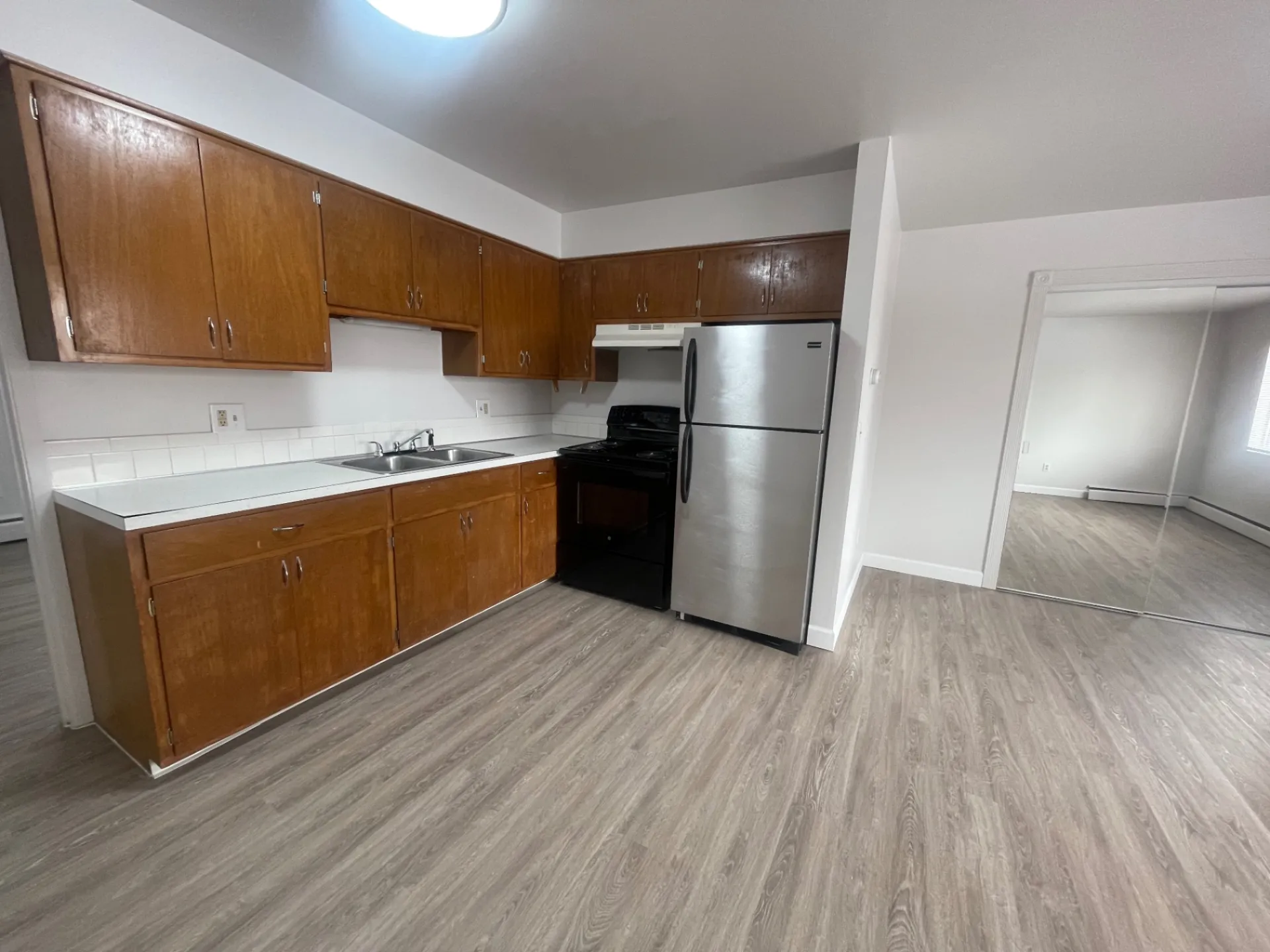 1827 N 4th St. Unit 8 kitchen view with stainless appliances and view into bedroom
