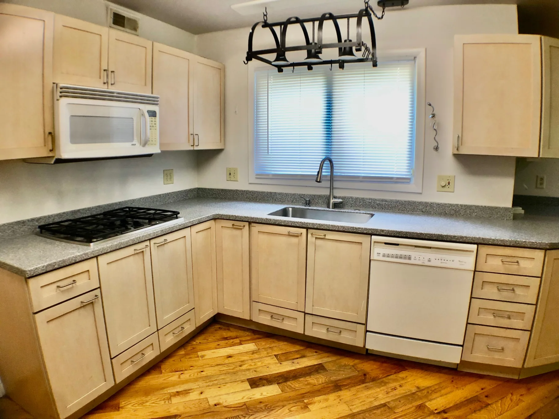 2040 Iuka Ave House kitchen with gas cooktop, dishwasher, and hanging pot rack