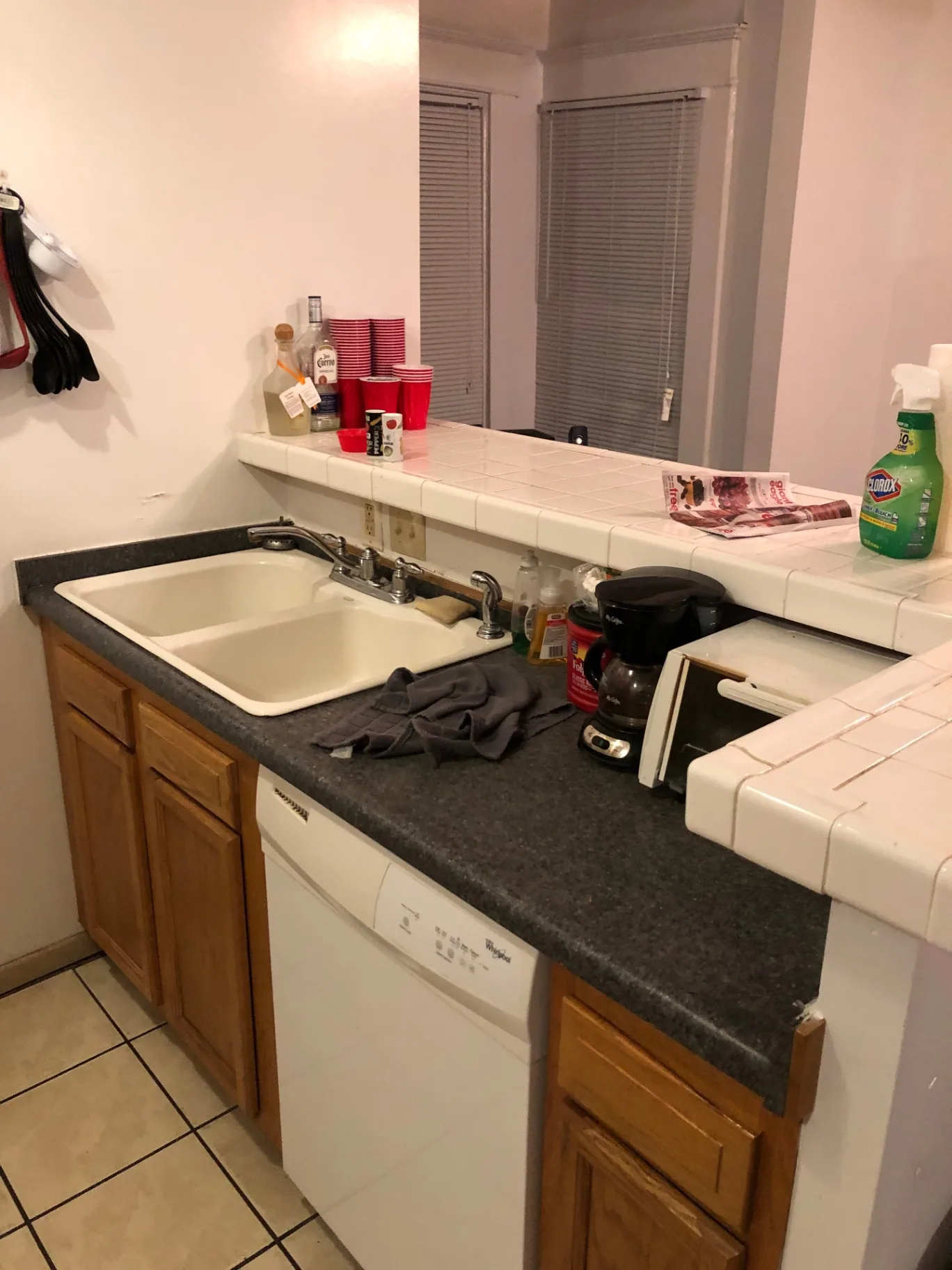 77 E Patterson Ave. kitchen with double sink, dishwasher, and breakfast bar pass-through