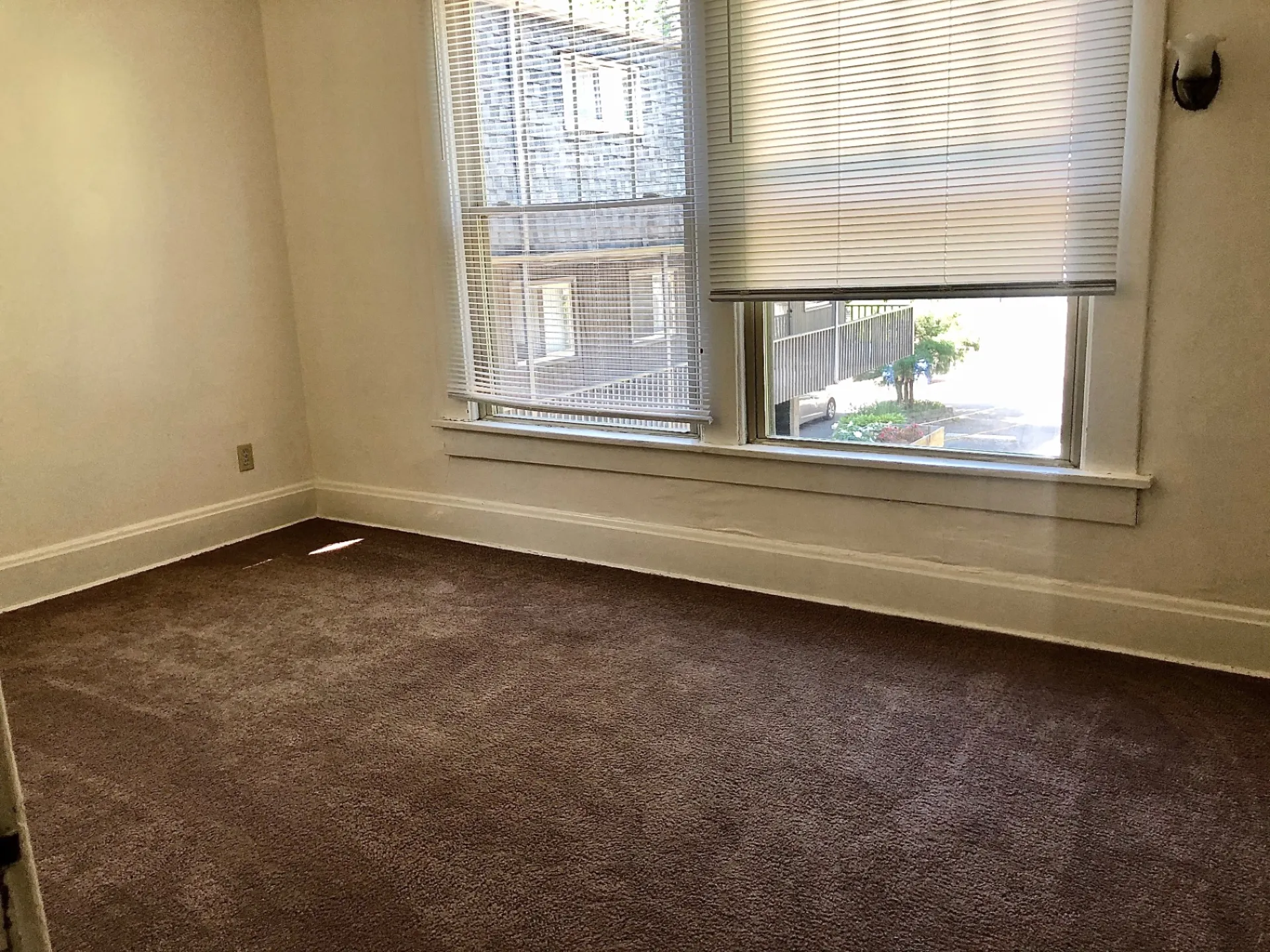 2015 Summit St. carpeted bedroom with large windows overlooking the street
