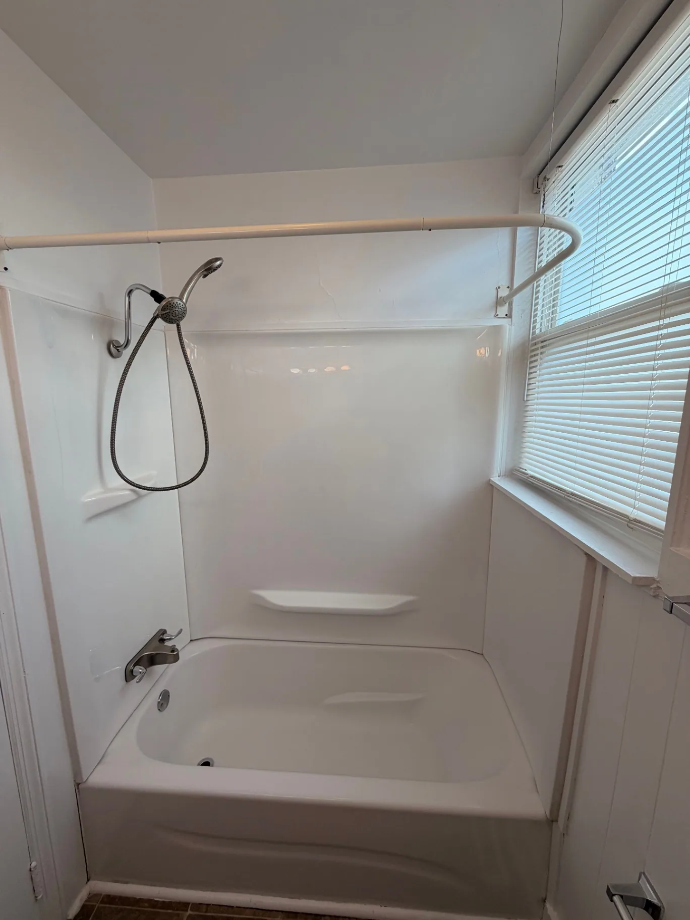 3340 Chestnut Upstairs updated tub and shower surround with handheld showerhead