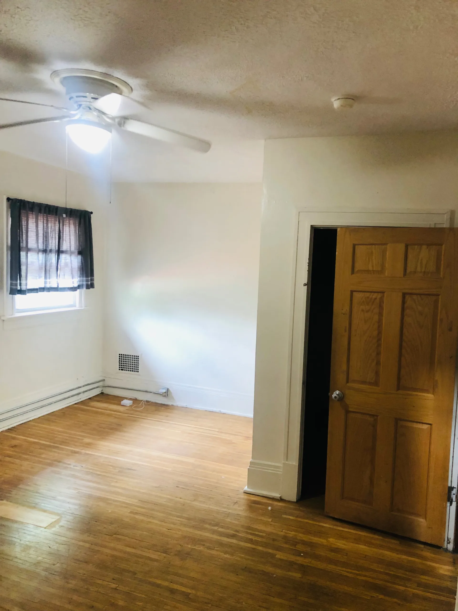 2005 Summit St. bedroom with hardwood floors and ceiling fan