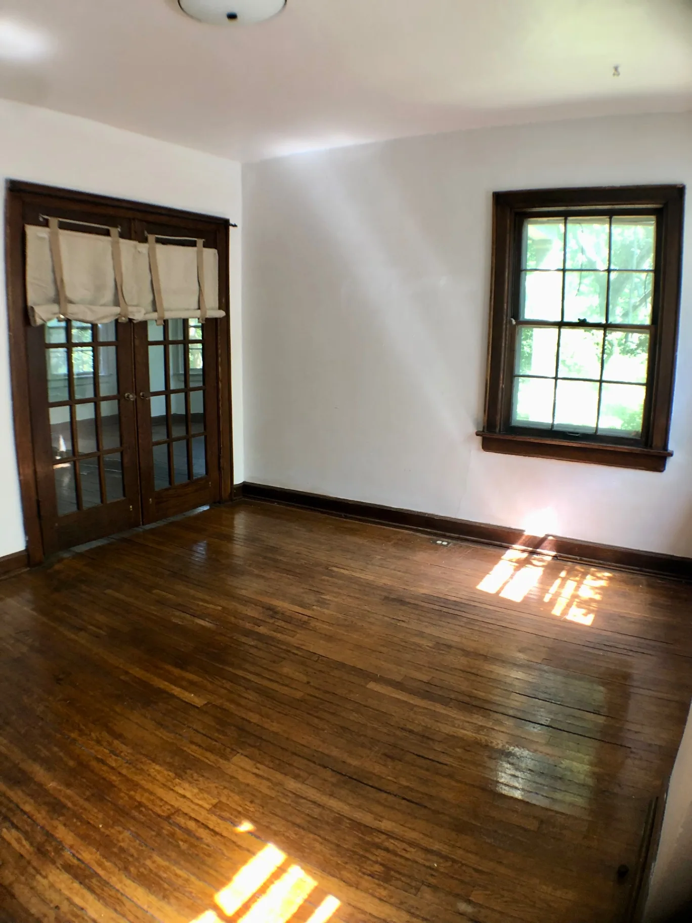 2044 Iuka Ave. A additional view of room with French doors and refinished hardwood floors