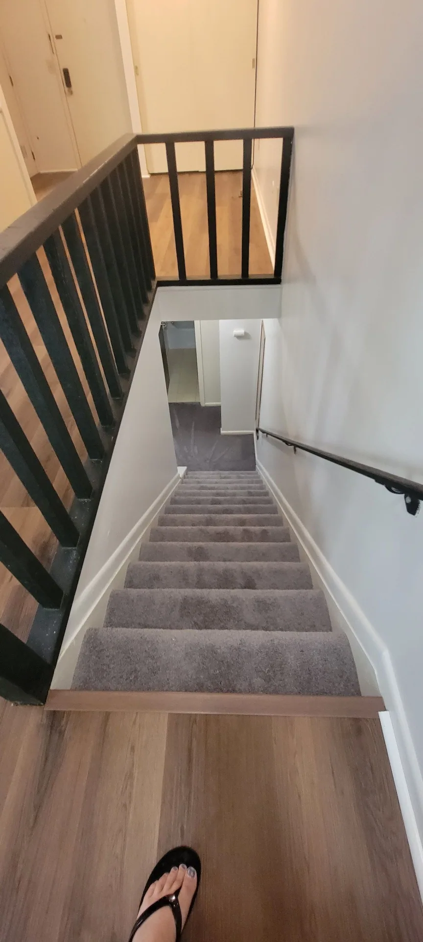 2024 Summit St. carpeted staircase leading from the main level to the lower level