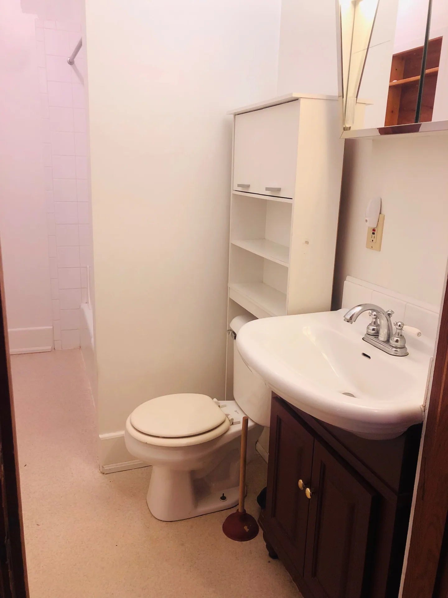 2026 Iuka Ave C full bathroom with pedestal-style vanity, storage tower, and tub/shower