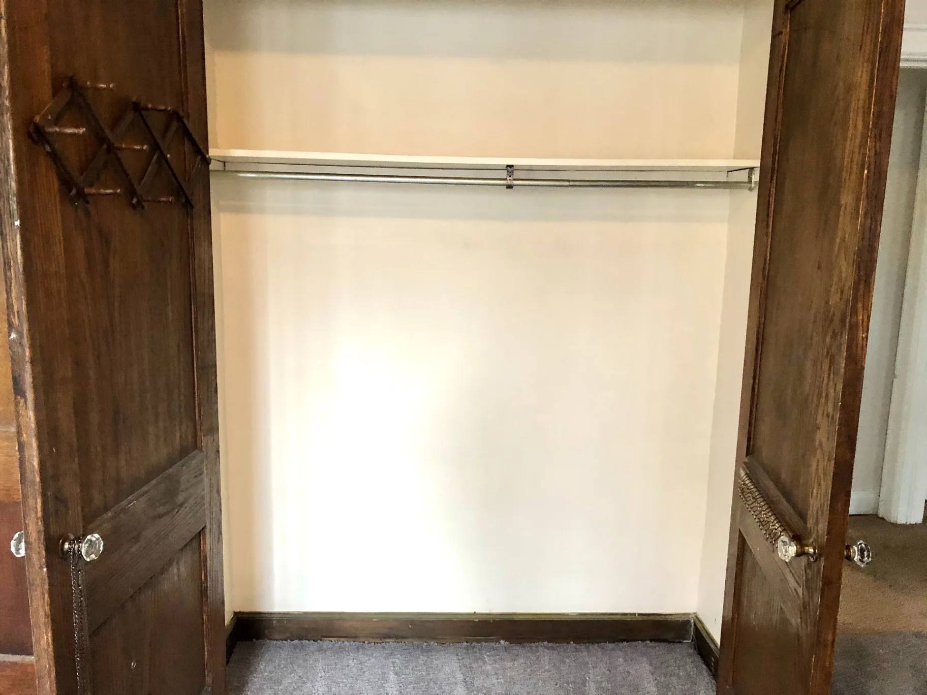 2044 Iuka Ave. B bedroom closet with dual French doors and original crystal knobs