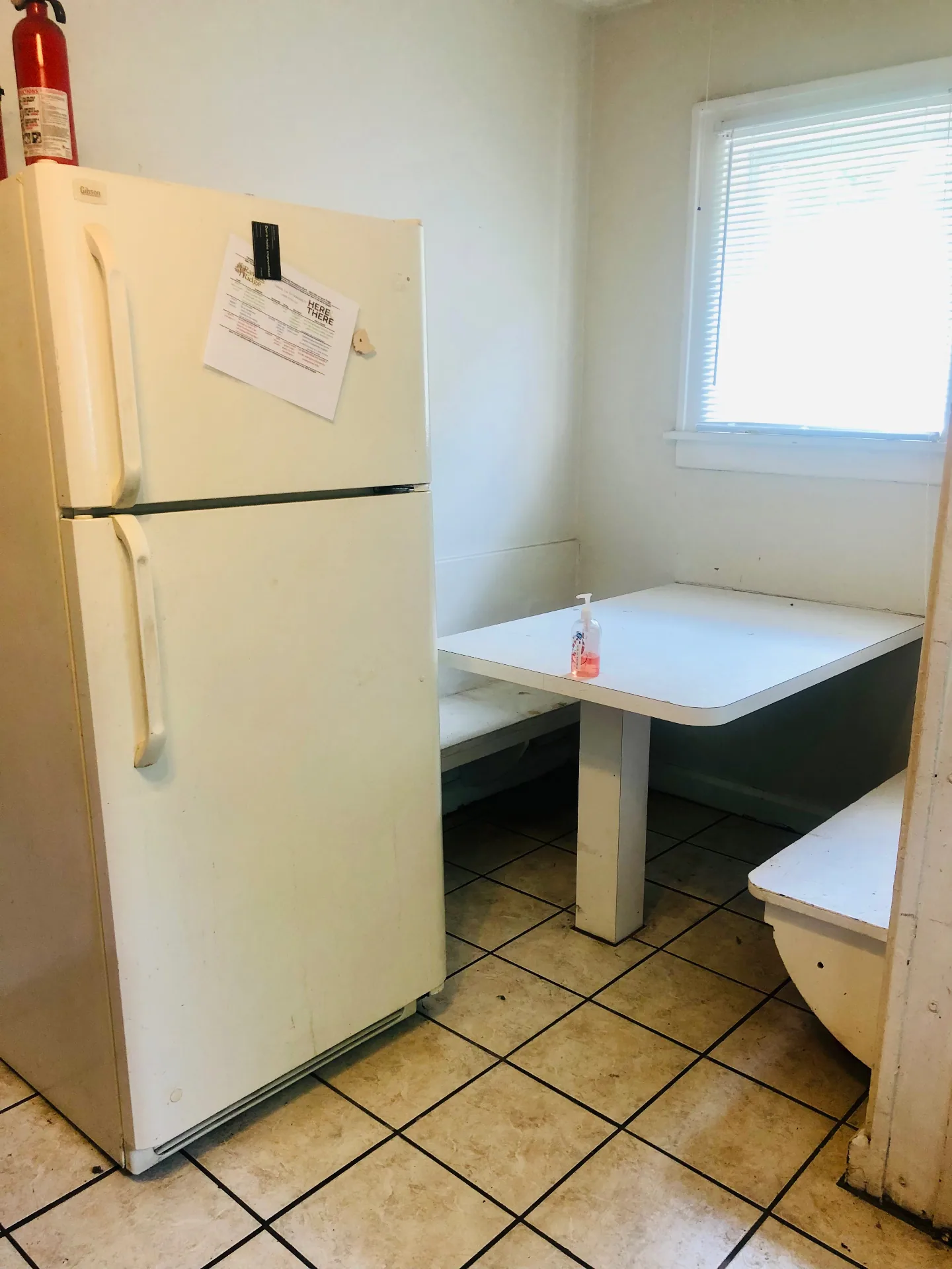 2155 N 4th St. built-in breakfast nook with fridge and tile floor
