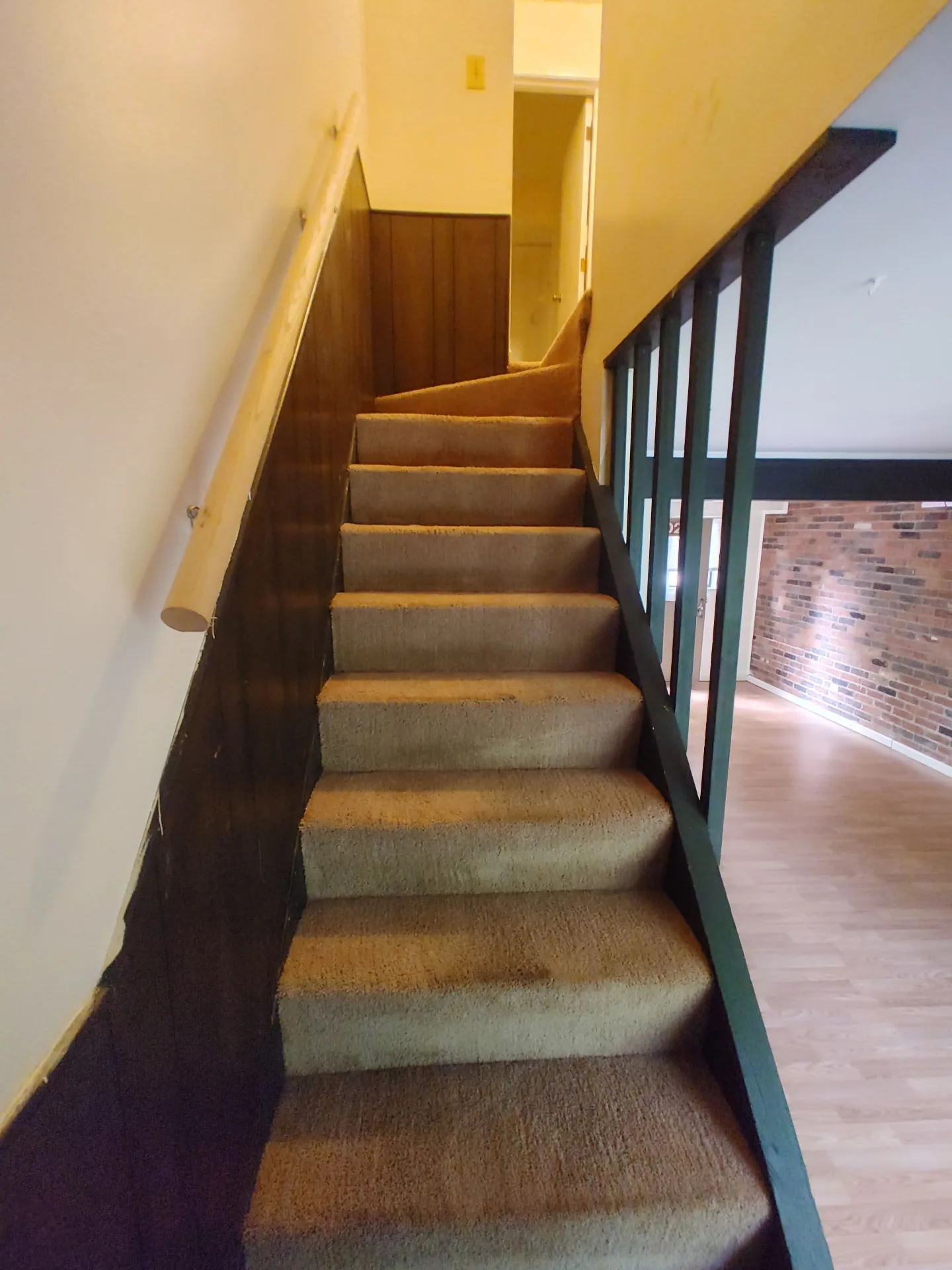 2020 Iuka Ave. carpeted staircase leading to the upper level bedrooms