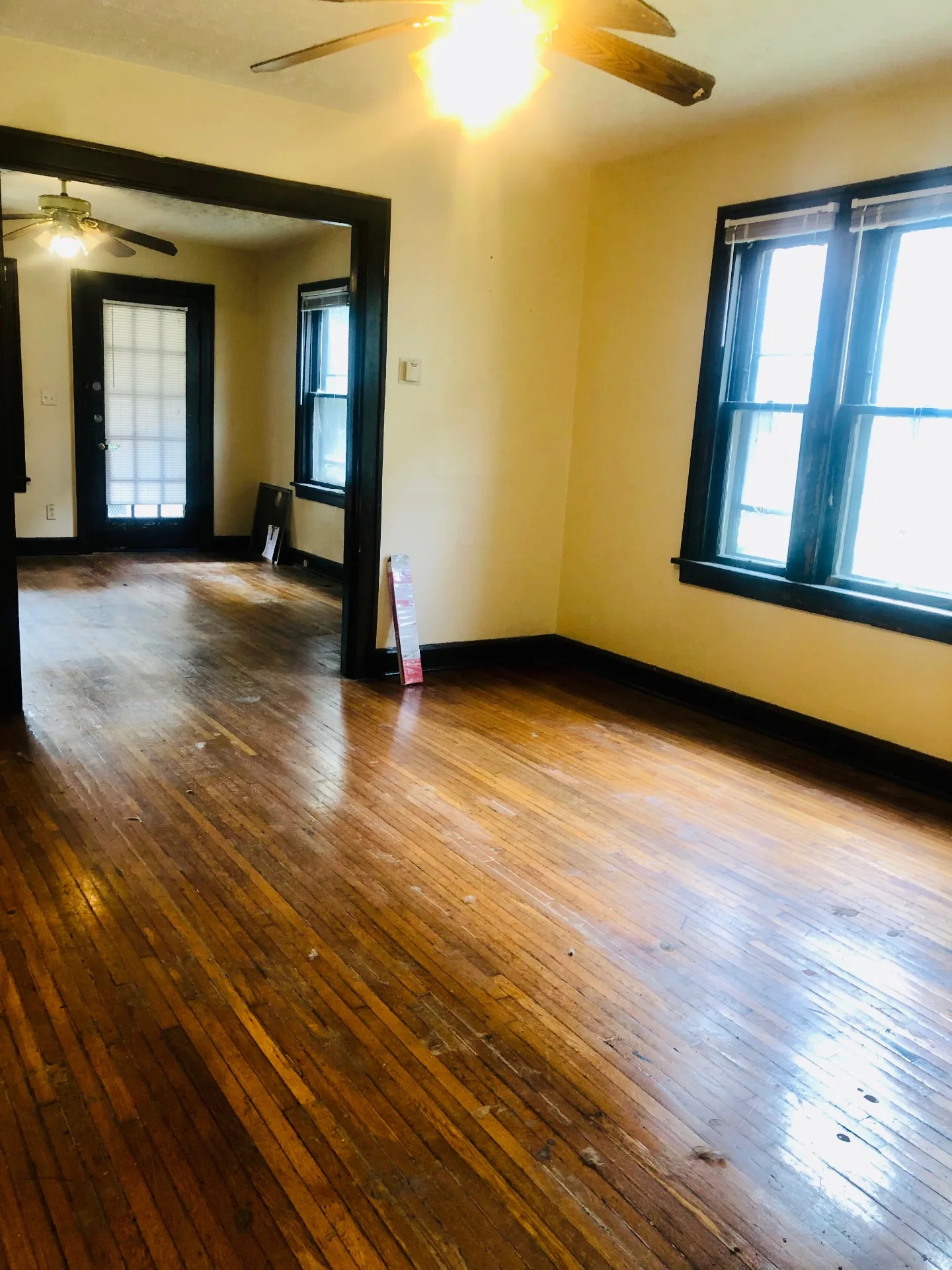 2155 N 4th St. open living and dining rooms with hardwood floors and front door