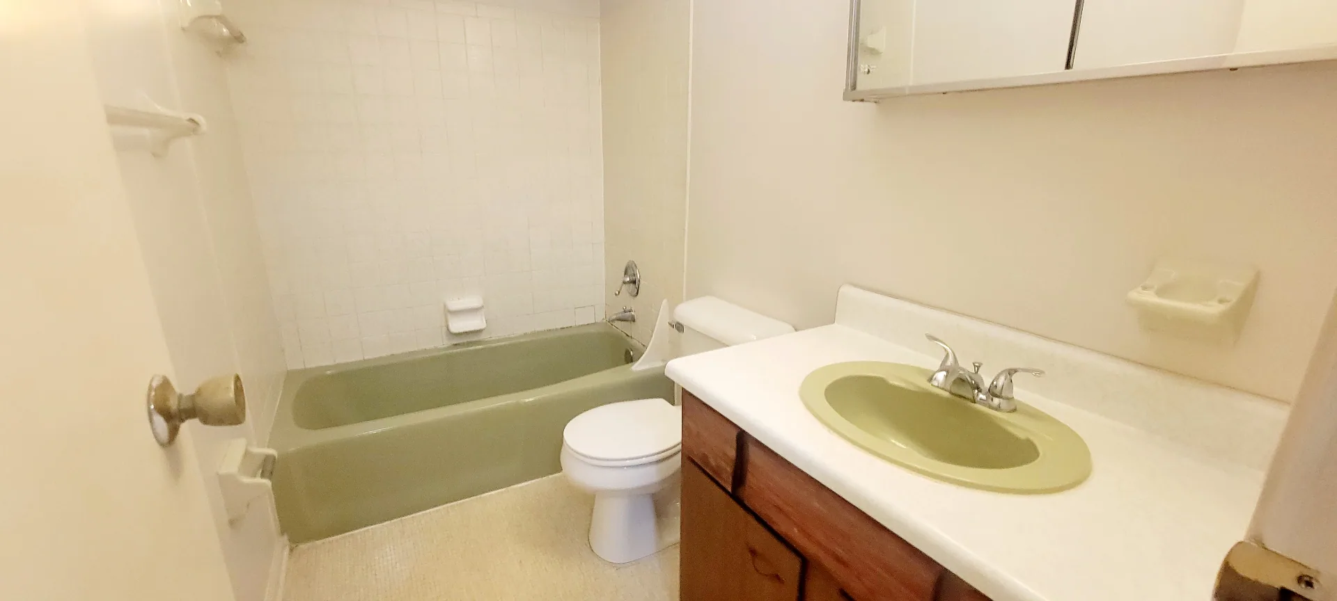 2022 Iuka Ave. full bathroom with tub-shower combo, vanity with medicine cabinet, and tile surround